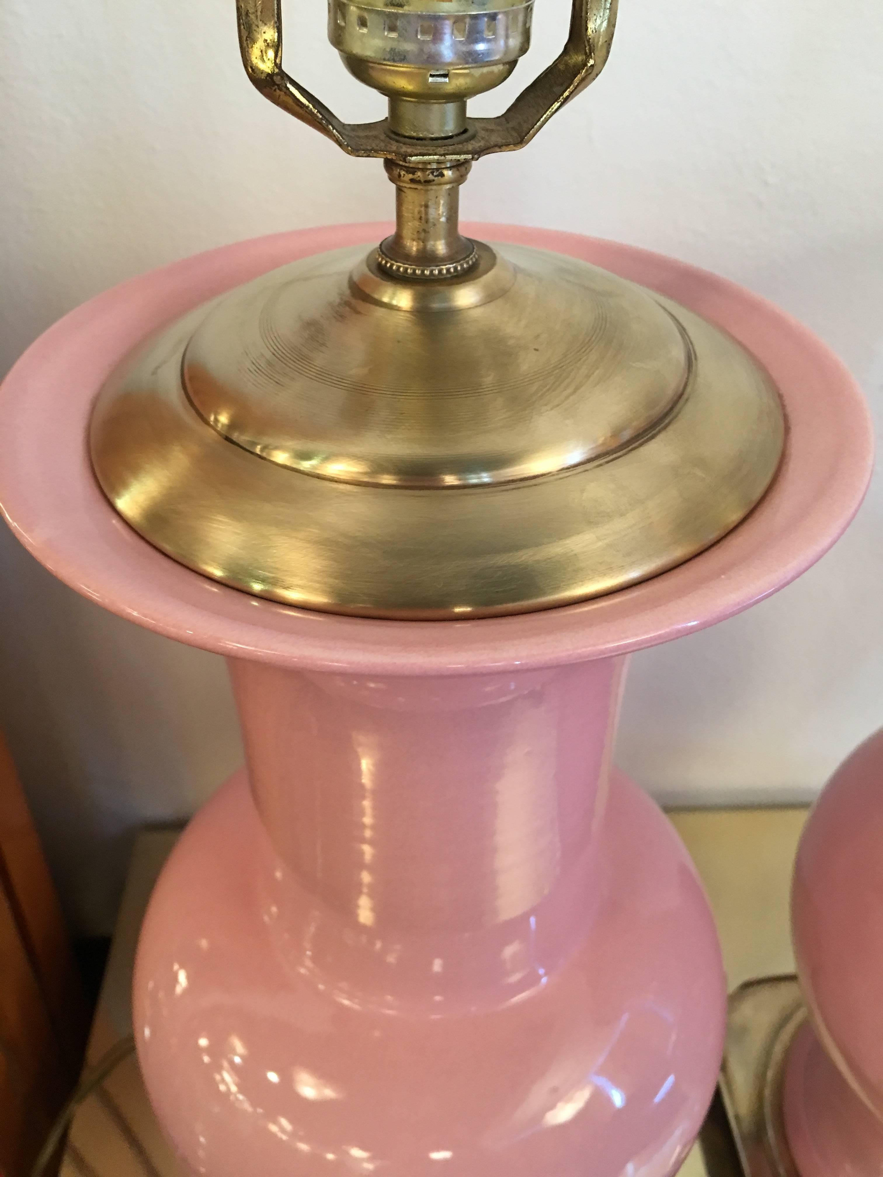 Amazing pair of vintage pink ceramic and brass table lamps. I picked these up about 5 years ago and forgot I had them. They came out of the Breakers Hotel in Palm Beach. I picked up a few pinks and a few white/grey. They have lovely pagoda style