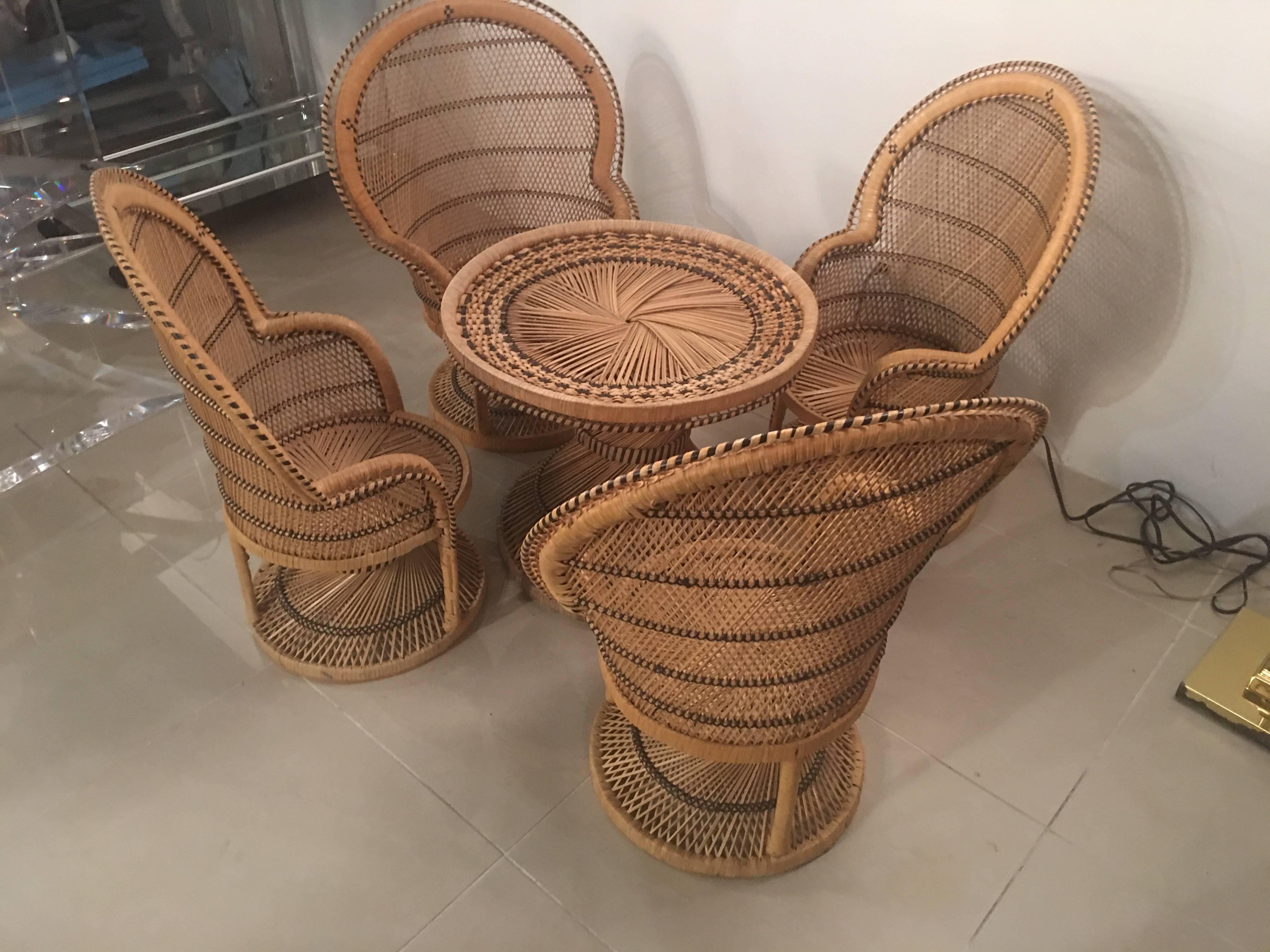 Such an amazing, one of a kind, vintage children's, kids Rattan and wicker dining set. Includes four Rattan peacock, fan back chairs and a matching table. This can be used inside the home playroom or on a porch, patio. I will have a small round