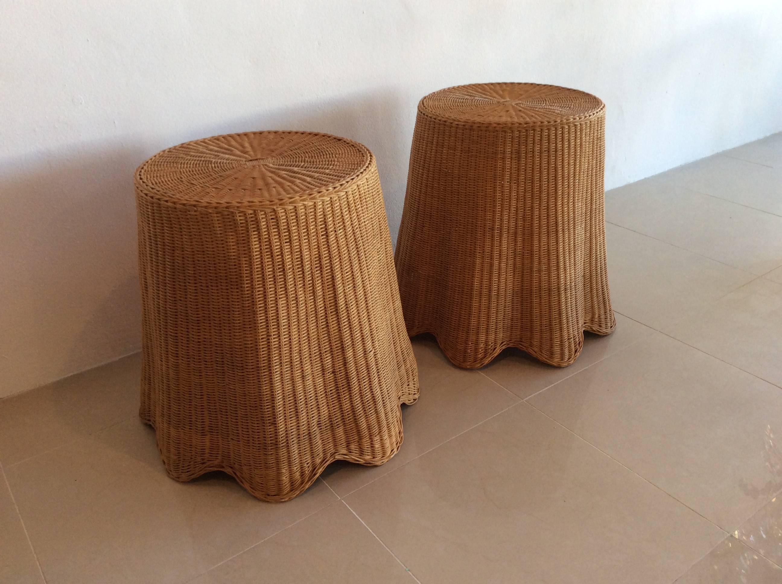 Lovely vintage pair of wicker drapped end side tables. The wicker is in excellent condition with no flaws. Top diameter is 18.