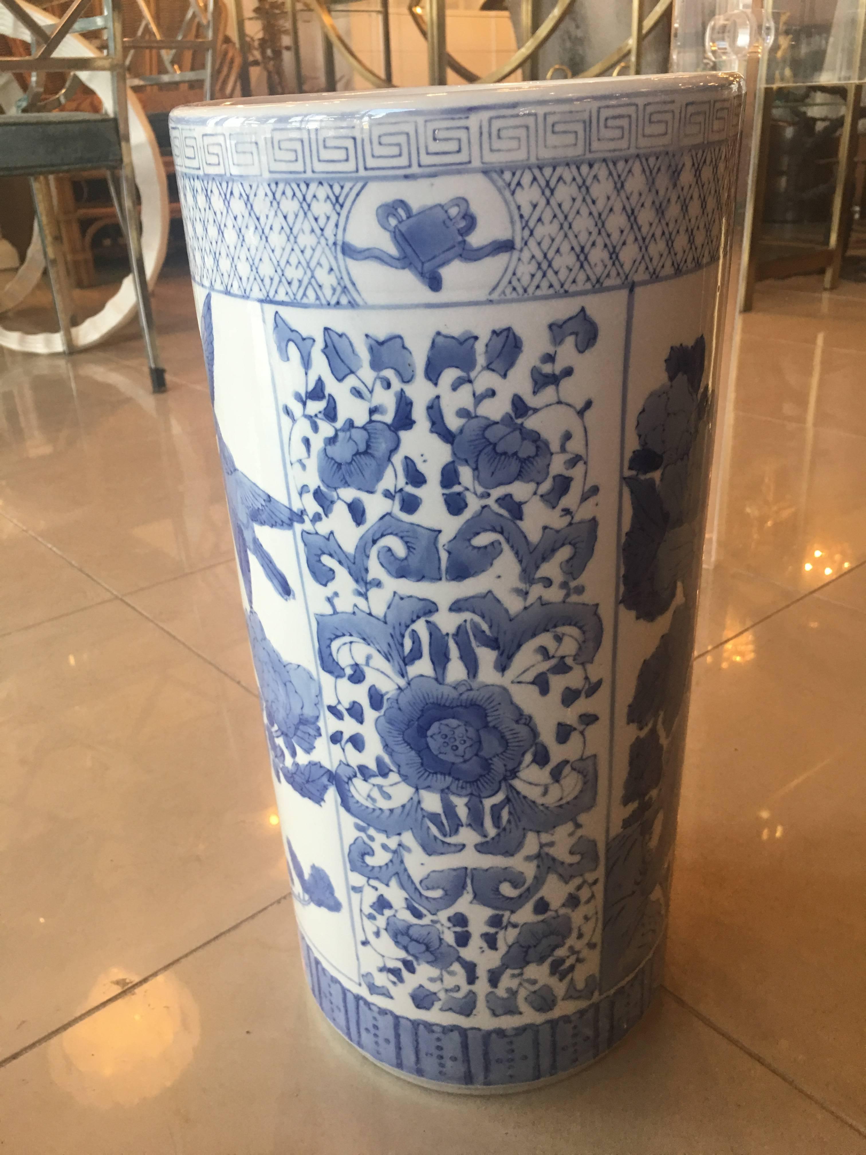 Beautiful vintage blue and white umbrella stand, made in China. No chips or breaks. Floral, bird and Greek key motif.