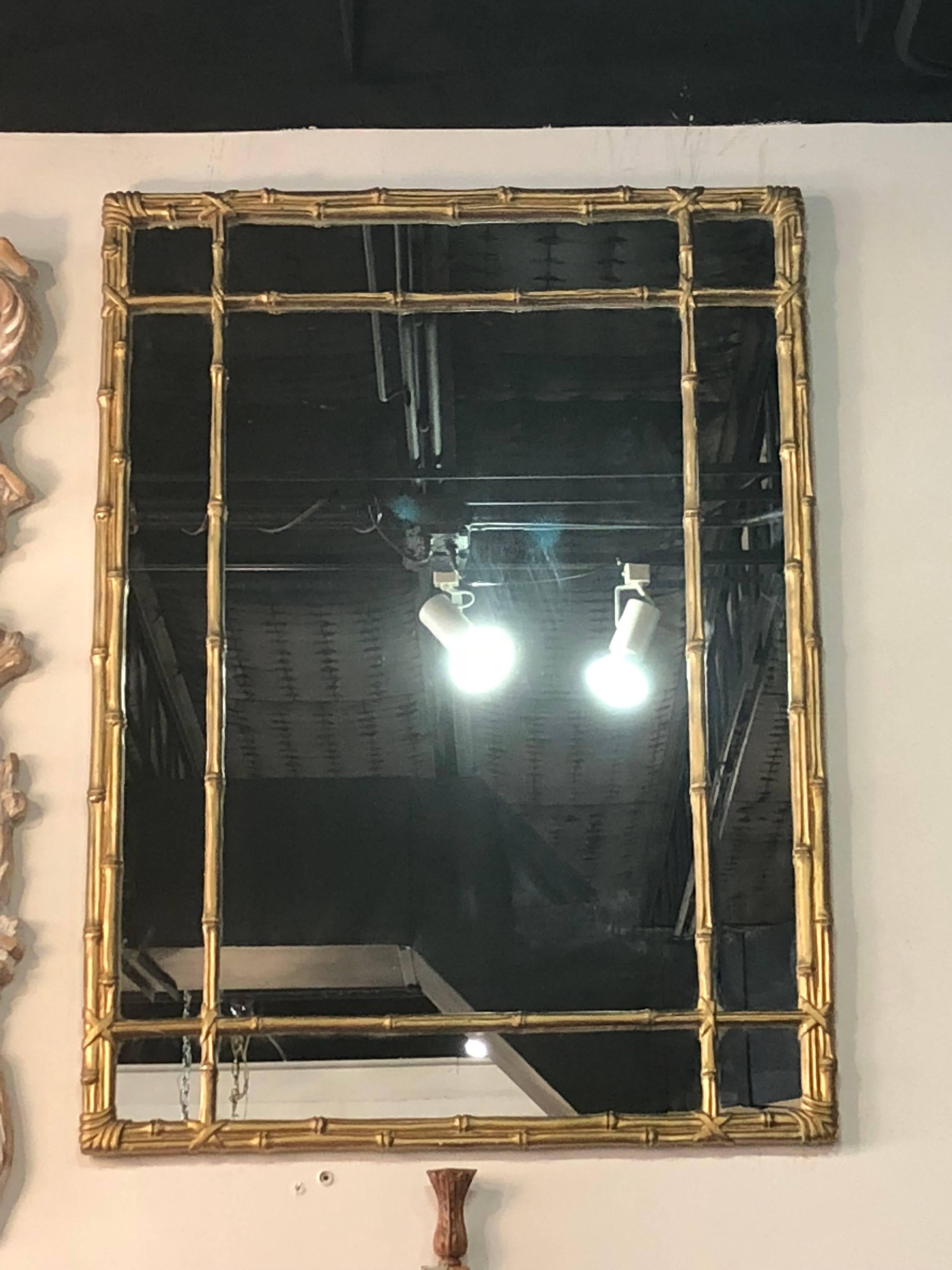 Vintage faux bamboo gold wall mirror. Original finish. Comes ready to hang.