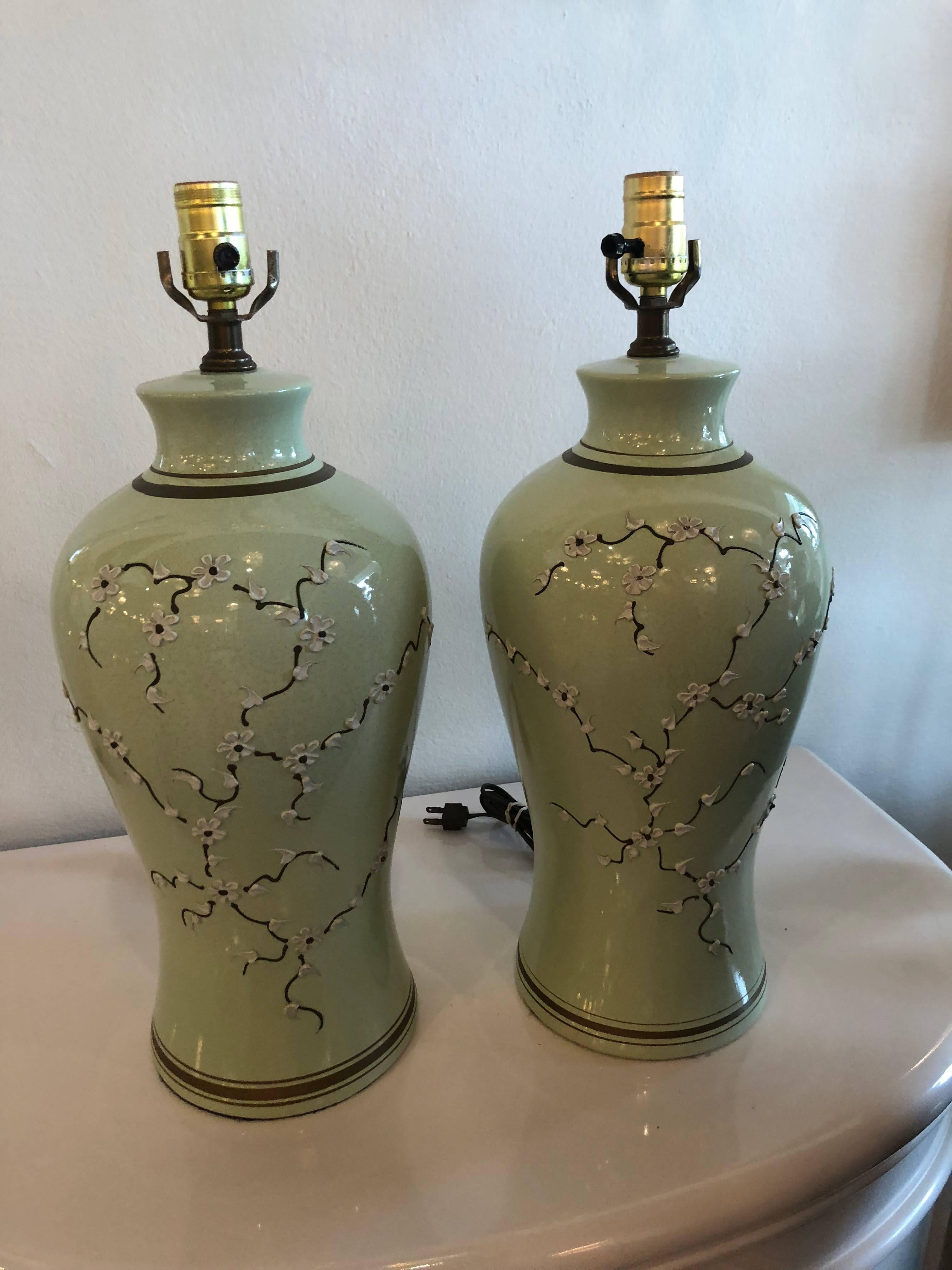 The most perfect pair of vintage Chinoiserie lamps! I just adore them! Light green celadon color with gold accents and little cherry blossom icing floral garland. These remind me of De Gournay wallpaper! These will be newly wired, with new gold