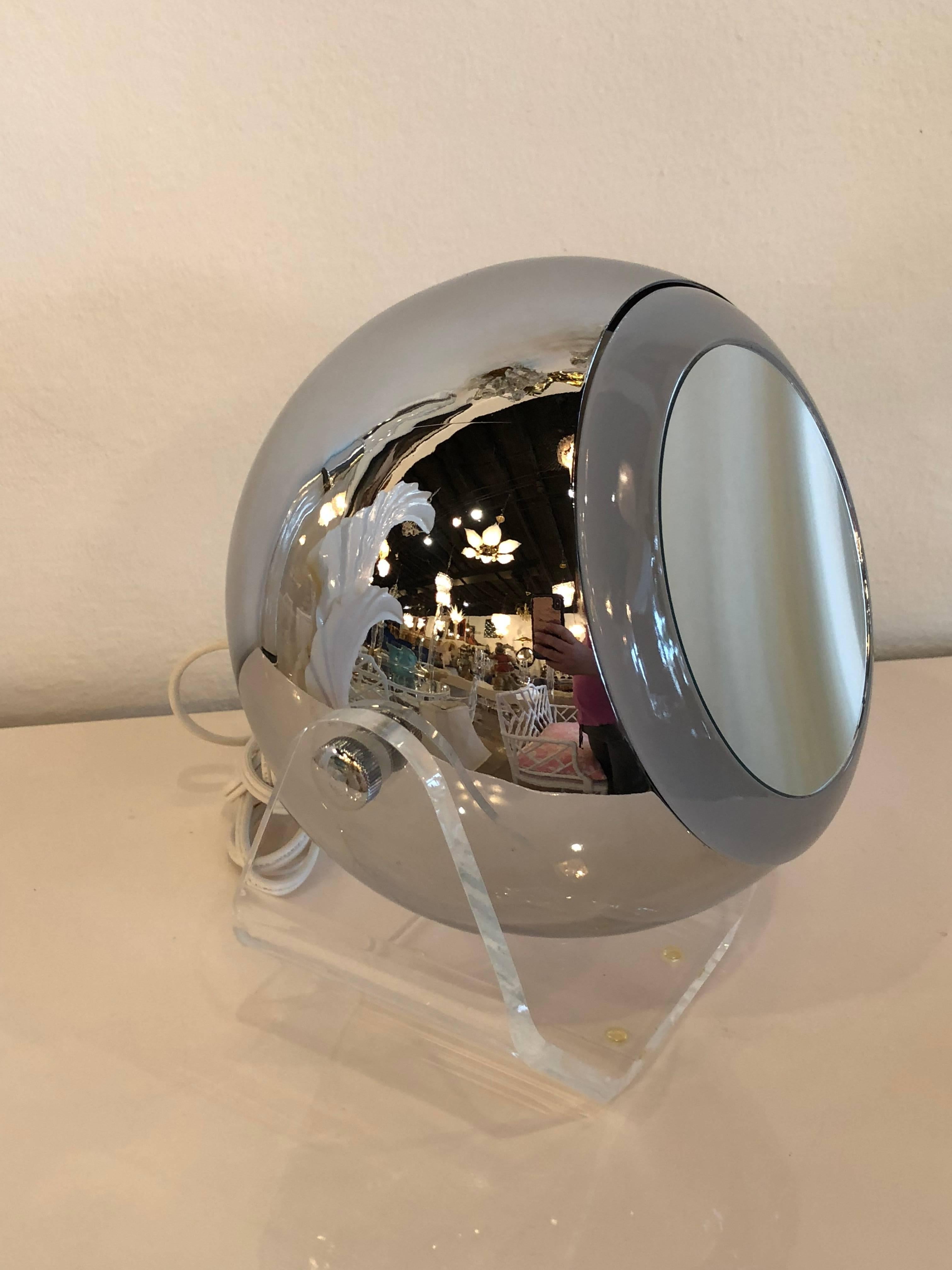 Vintage Robert Sonneman chrome and Lucite swivel eyeball vanity mirror light. Lights up, swivels. Close up mirror.
   