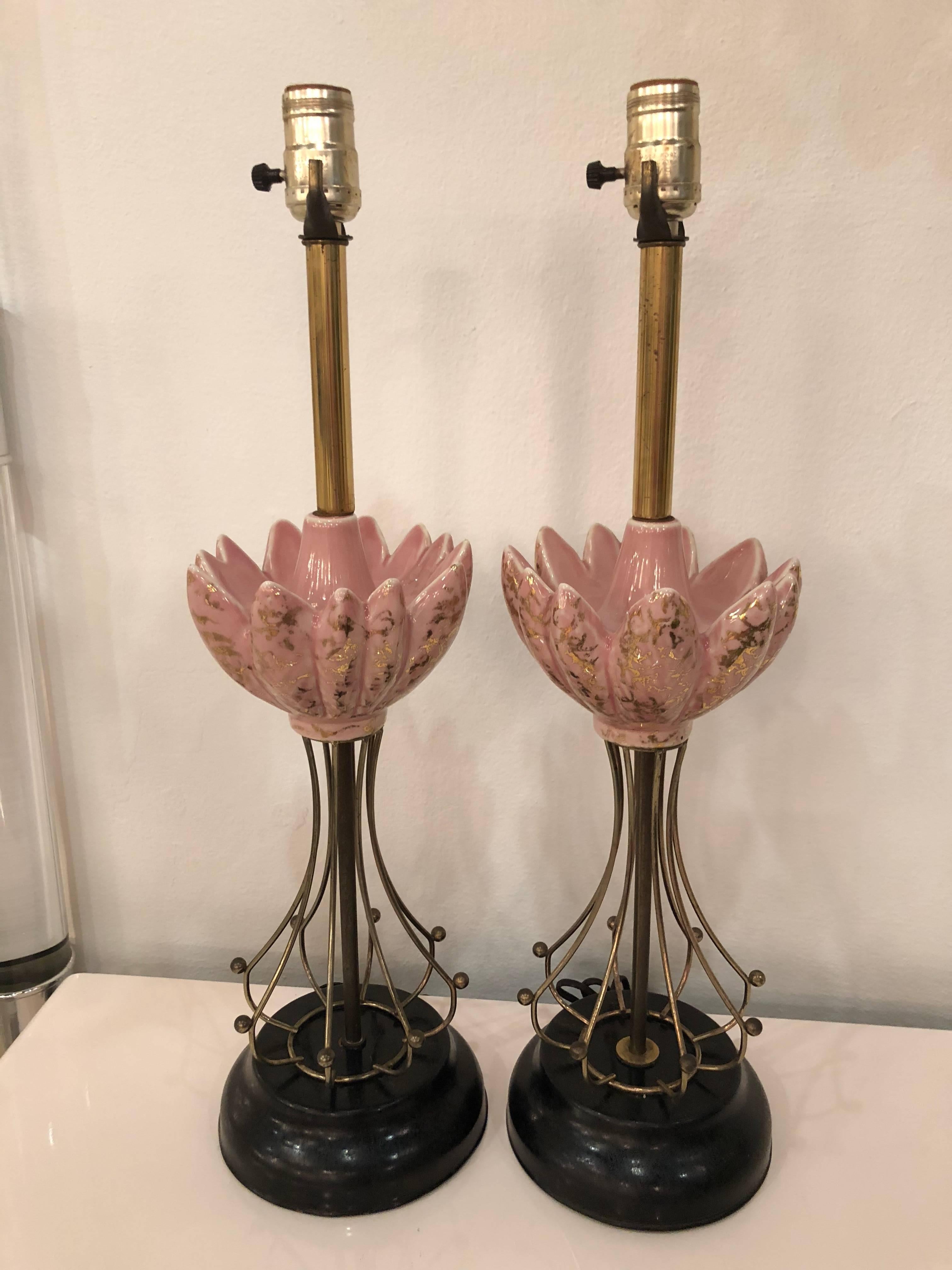 Pair of vintage pink, black and gold lamps with brass details. I love these! These will be newly wired prior to shipping. There is patina on the black metal bases and the brass metal.