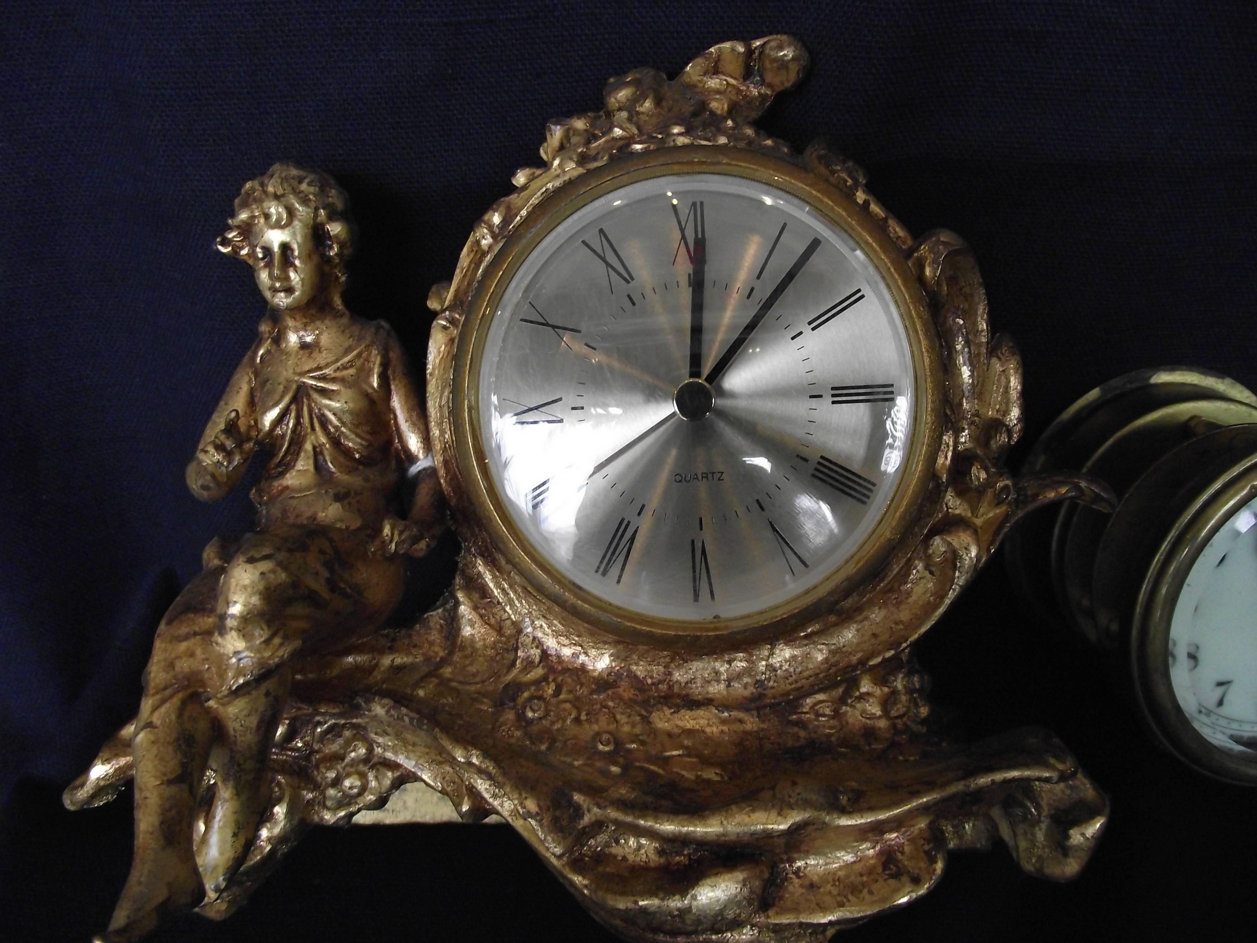 This beautiful Art Nouveau clock is outfitted with a battery insert clock.

The original works are included with the clock. The original works are eight-day wind and is in need of approx. $200.00 worth of work.

The gold finish has been restored