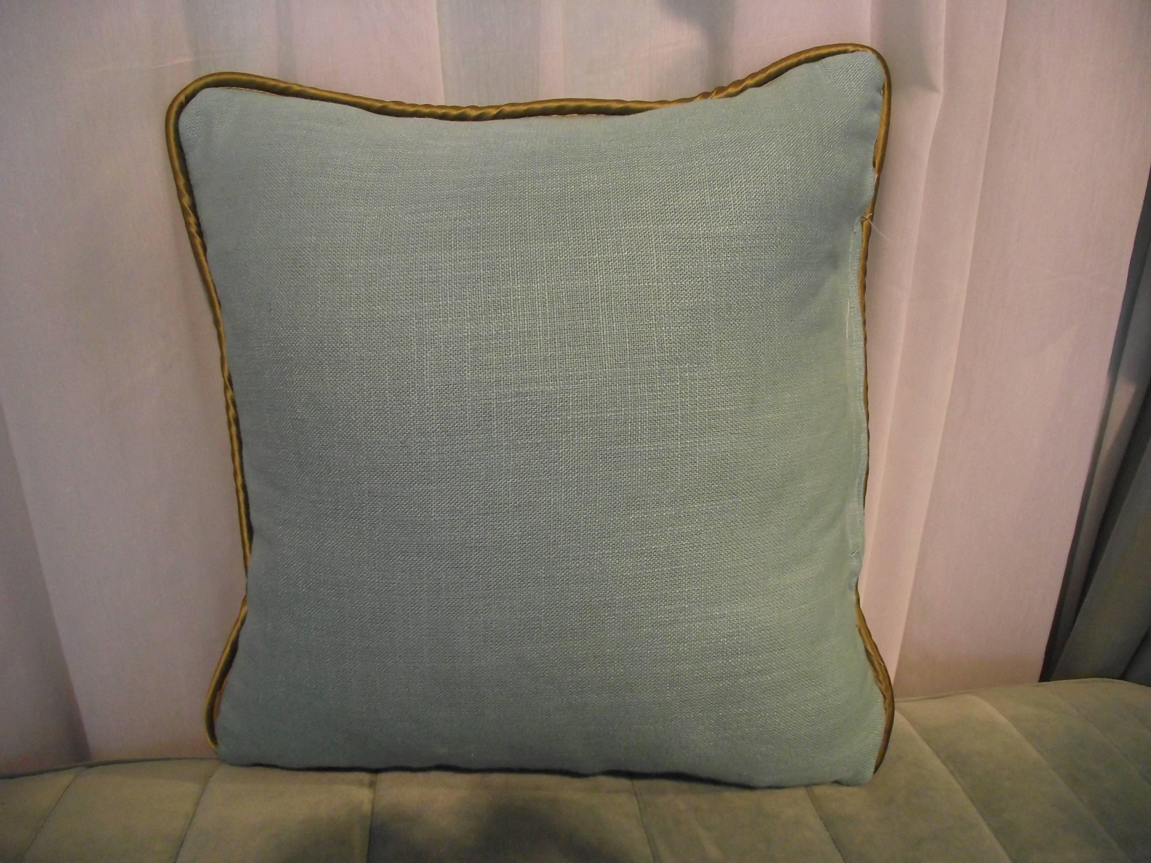 Another original design from Gantt Design Studio, this pillow brings together three colors of fabric and two textures.

The front cover is patterned with olive and light blue linen joined with soft blue velvet.

This unusual throw pillow is a