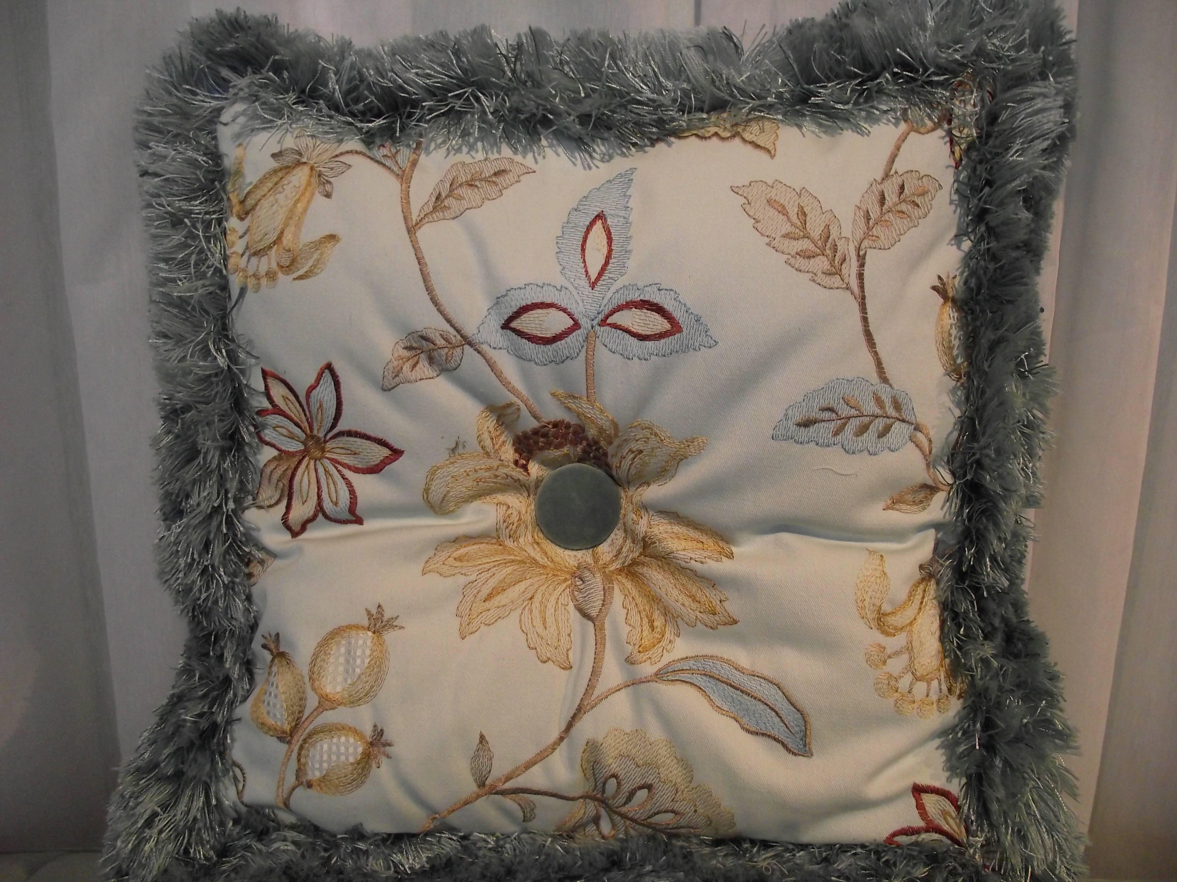 I have been mitering "patterns” for years now. It was an original idea of mine and I am not aware of anyone else doing it.

These unusual pillows feature an embroidered , mitered floral pattern on the front and
an overall embroidered design