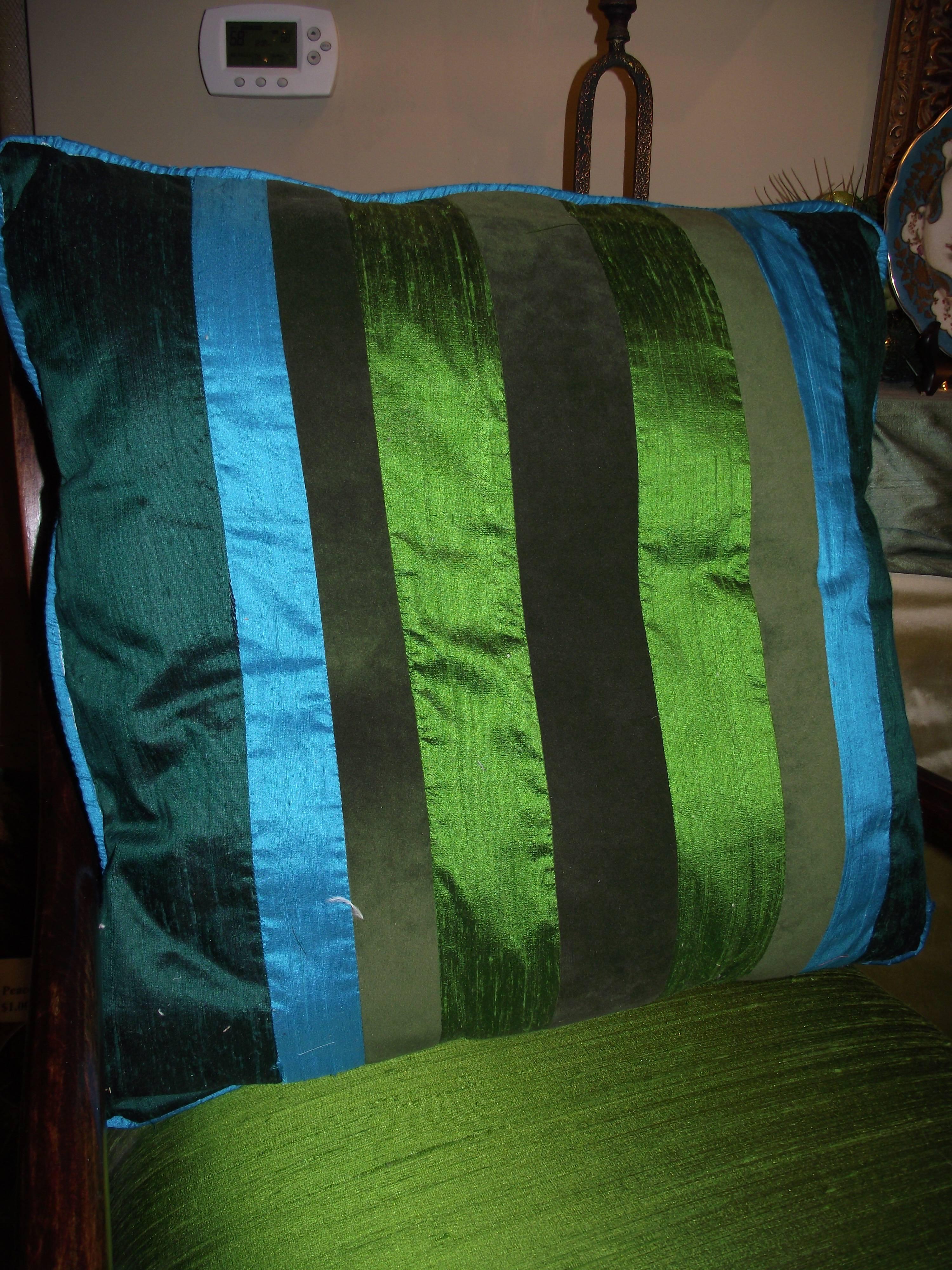 Another original design from GANTT Design Studio, this unusual and beautiful pillow features colors taken directly from a peacock feather. The textures of shantung silk and velvet are combined in the pillow cover. The soft polyester bat pillow form