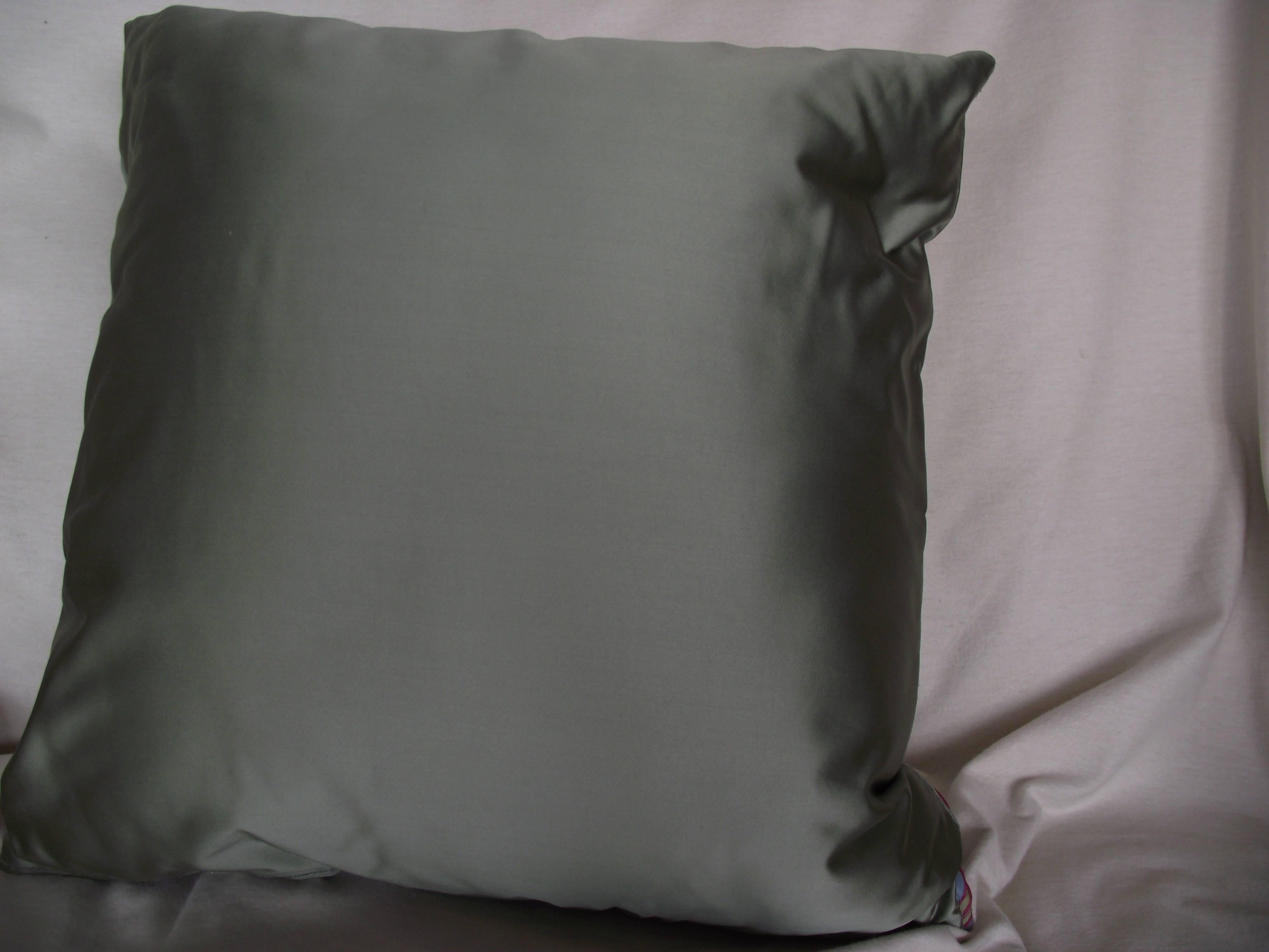 This original design by Gantt is handmade of soft shades of greyed out green satin and a fresh colored blue satin. 

Each color stripe is set off with a 1/16" red cord adding color and texture to this unusual pillow.

This is a comfort
