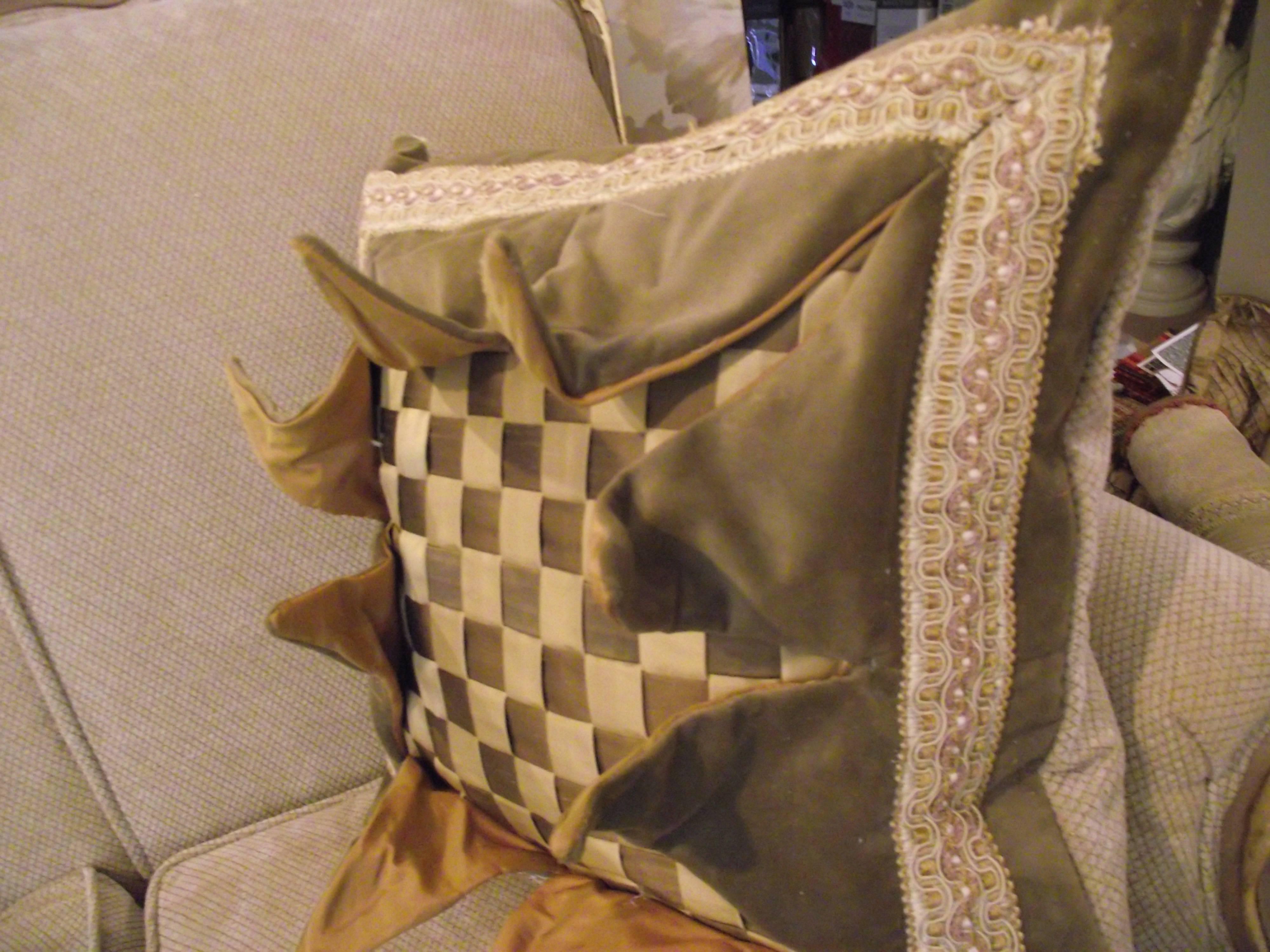 This is my first original design Explosion Pillow. It features silk strips woven into a checkerboard pattern. The front is made of light tan velvet lined in a coppery colored silk. The back is covered in light tan chenile.

Each explosion
