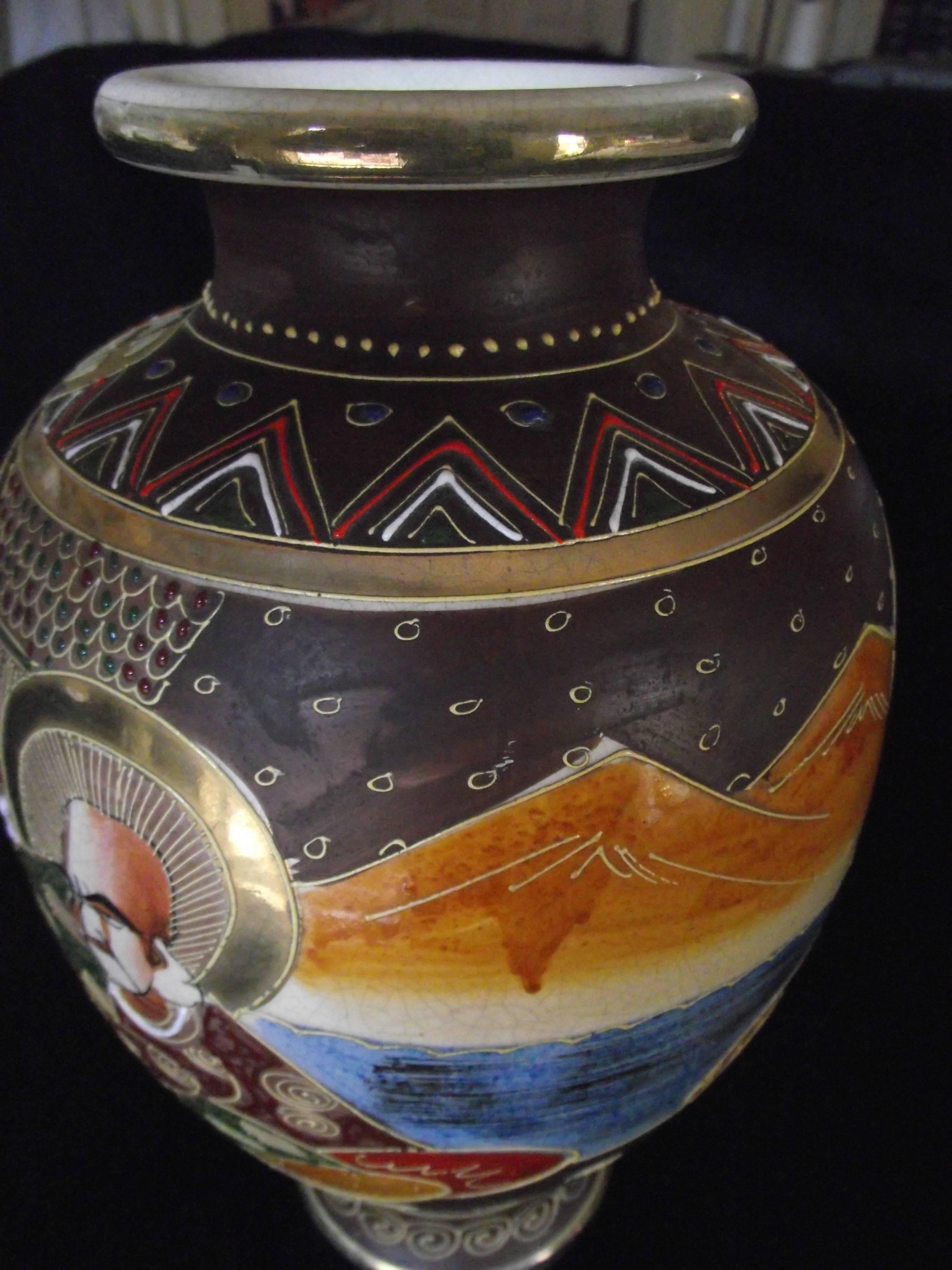 This large beautiful Satsuma vase bears the Satsuma mark as seen just above the woman's head in the first picture.

This vase is in remarkably good condition.

As you can see in the pictures there is no gold loss.

This vase is as close to