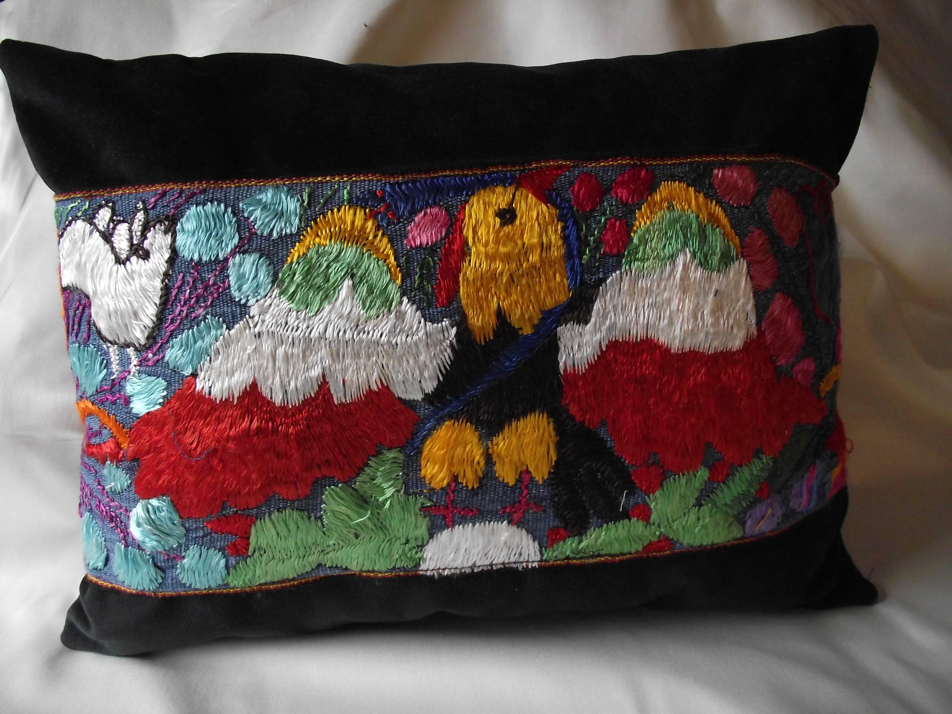 This unusual Lumbar Pillow is made from embroidered decoration from Antique Peruvian Ceremonial Cloth. The pillow itself is made of 100,000 double rub black velvet. The case has an invisible velcro closure giving access to the pillow form