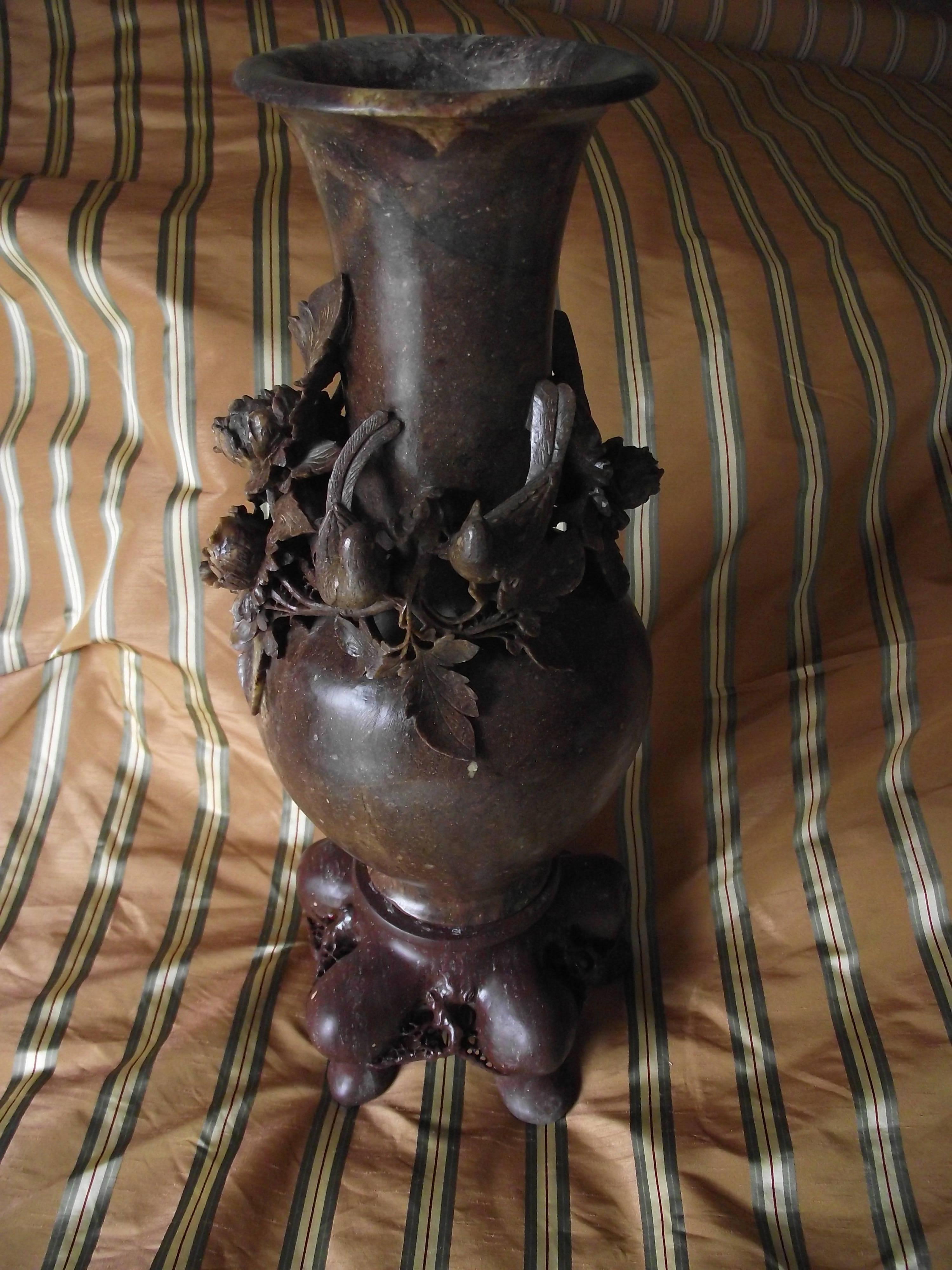 Extremely detailed carved oriental style brown soapstone vase for your consideration.

It stands 18