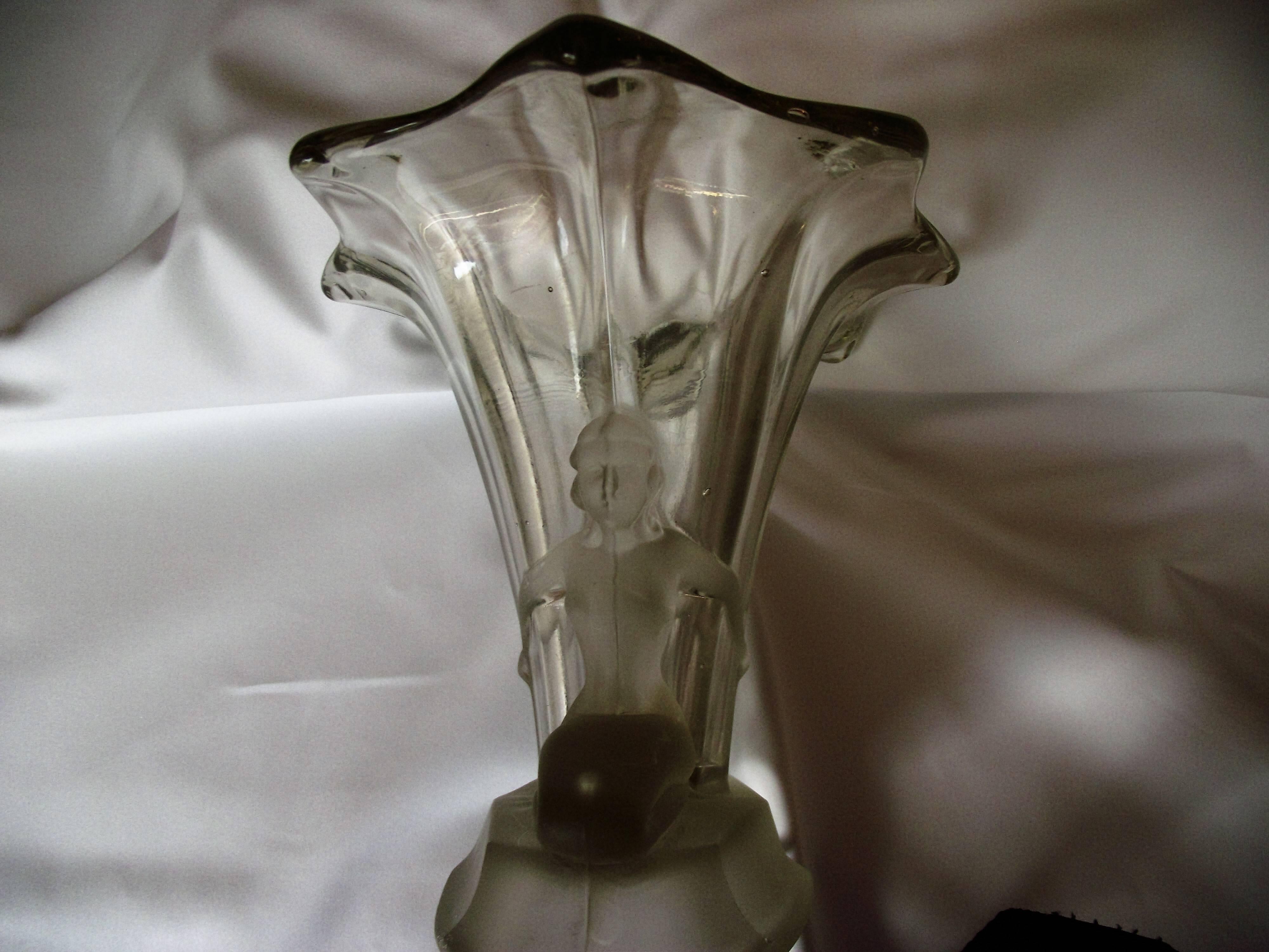 This vase is Classic Art Deco design. Made in 1930s Germany it features a frosted glass base with two nude woman.

It has the imperfections, inclusions and air bubbles that are normal for this kind of glass. Some scratching from normal wear,  Great