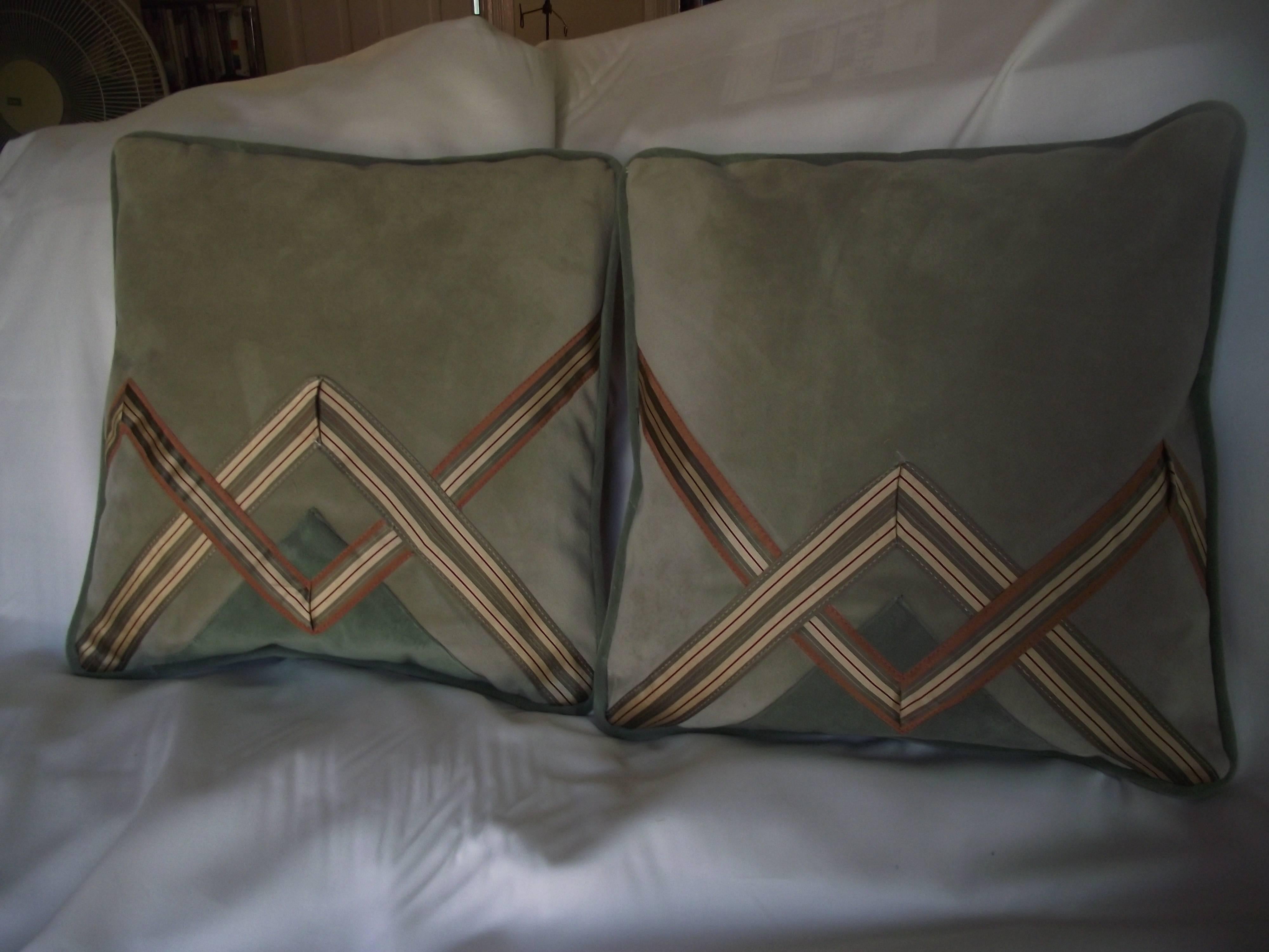 This pair of pillows are an original signed design by Gantts Design Studio. When placed side by side the design continues from one pillow through the next. 

The face of the pillow is of a hard wearing but soft velvet while the back are covered in