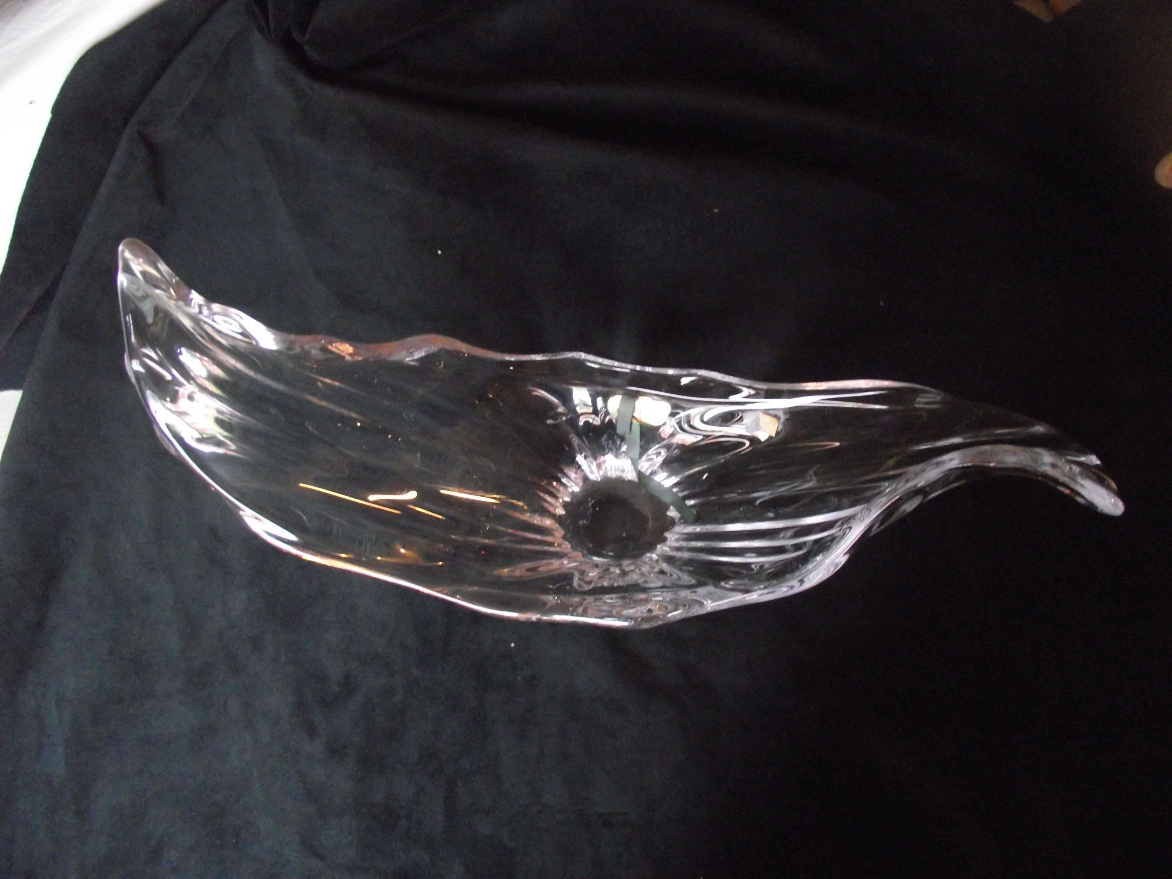 Made in France this striking center piece bowl is a fine example of Mid-Century Modern design. Its free-form design gives the illusion of ocean waves. This art piece has no mold marks, scratches, bubbles or chips. It is in perfect