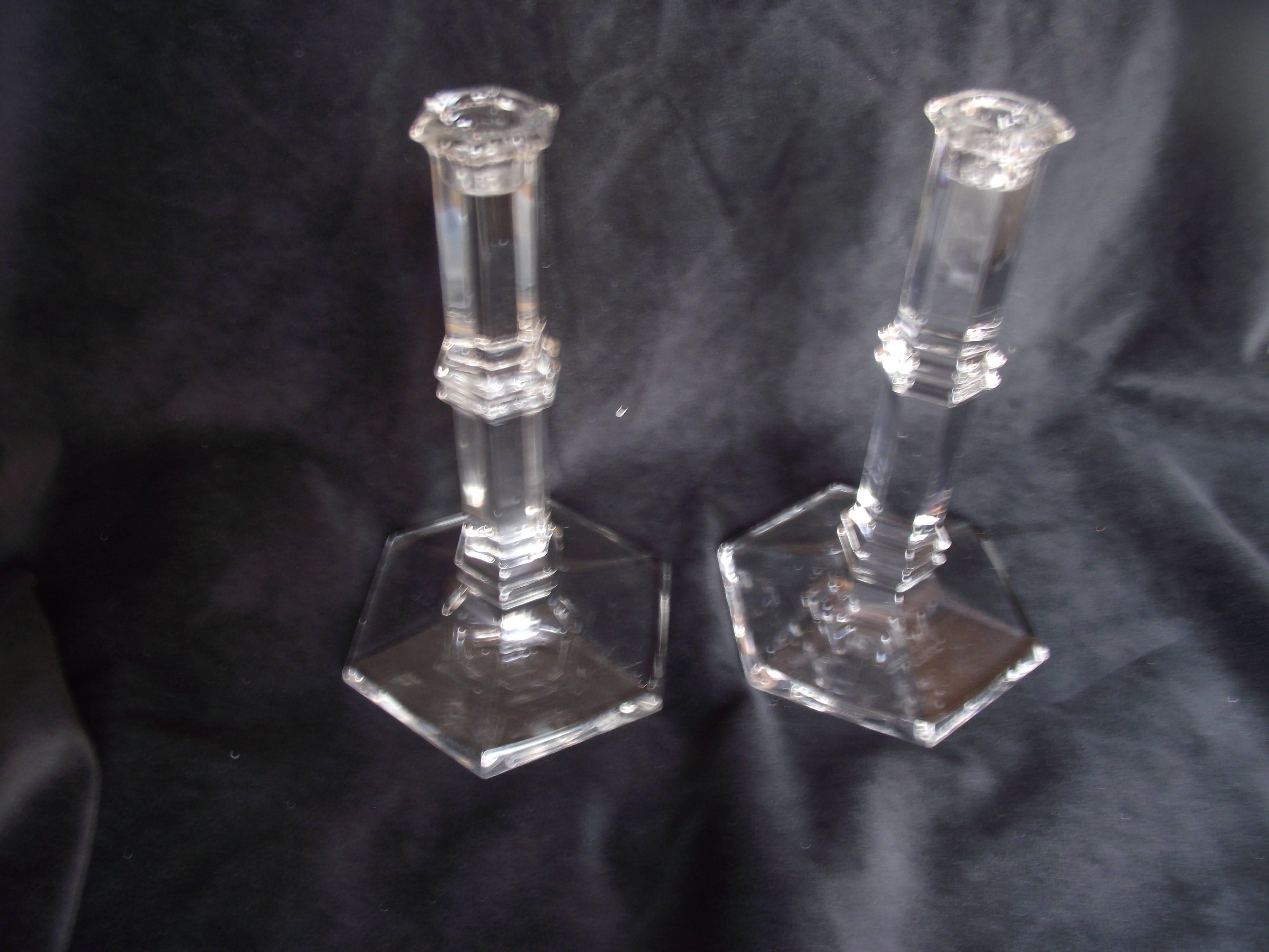 Exquisite pair of crystal candlesticks signed by Tiffany & Co. Clean modern lines.