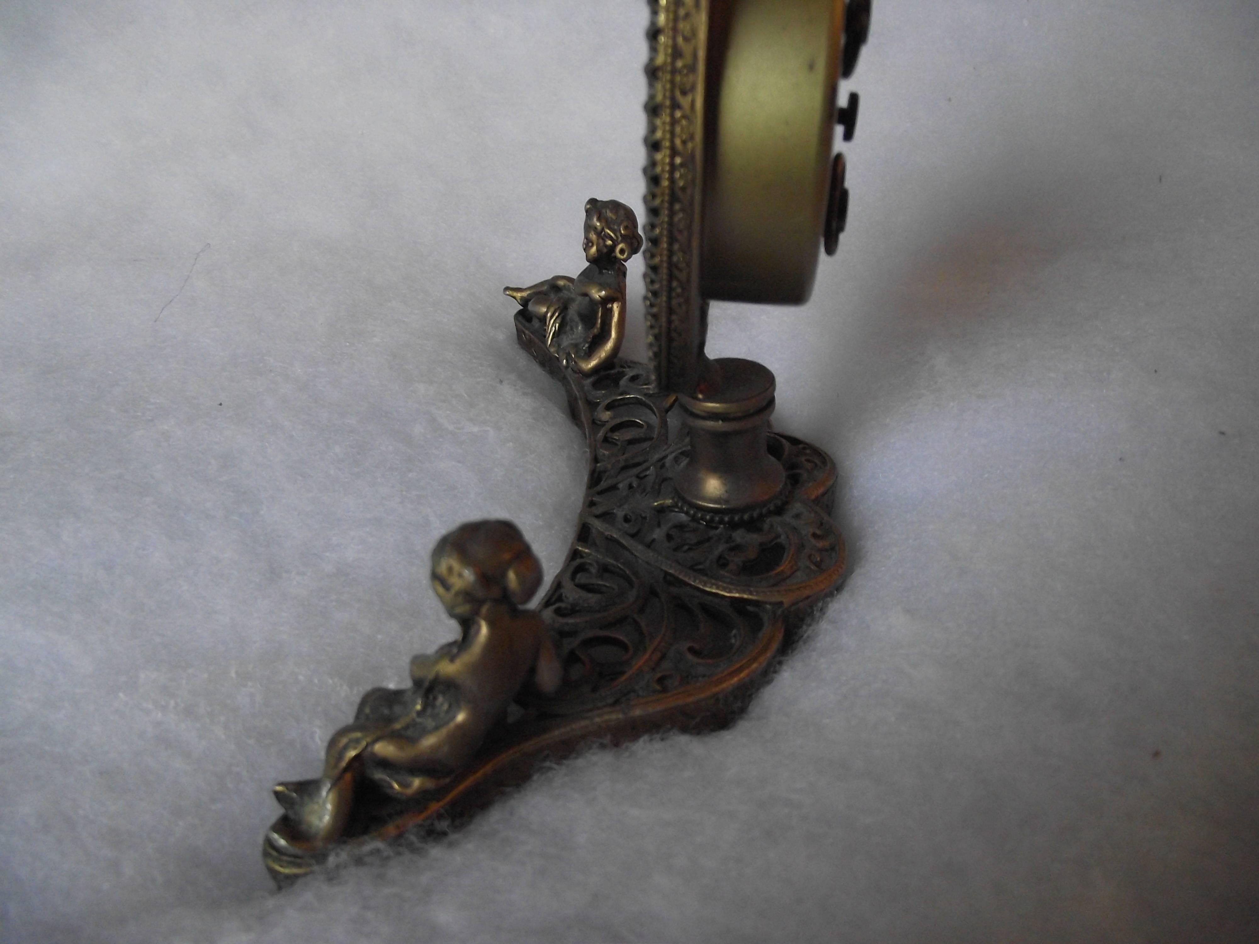 This charming little clock was made in Germany. Made as an alarm clock, the alarm does not work but the clock keeps time and needs to be wound every three days.

The rarely seen oval face makes this clock very special. It is made of spelter and has