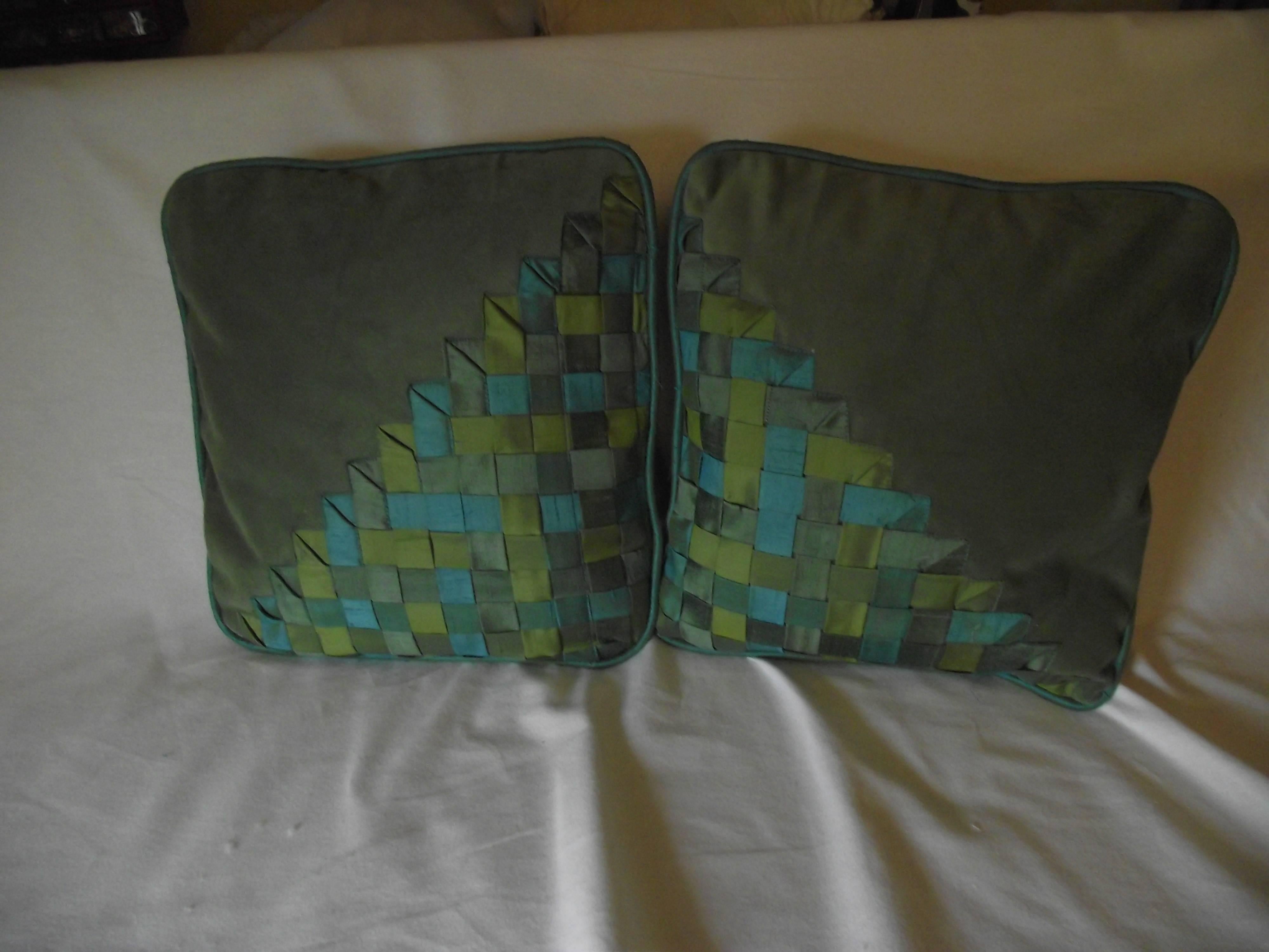 Great pair of asymmetric geometric designed pillows. They are an original design from Gantt Design Studio. The mirror image designs are created weaving three shades of green silk on a light green velvet fabric. The pillows are on soft hyper