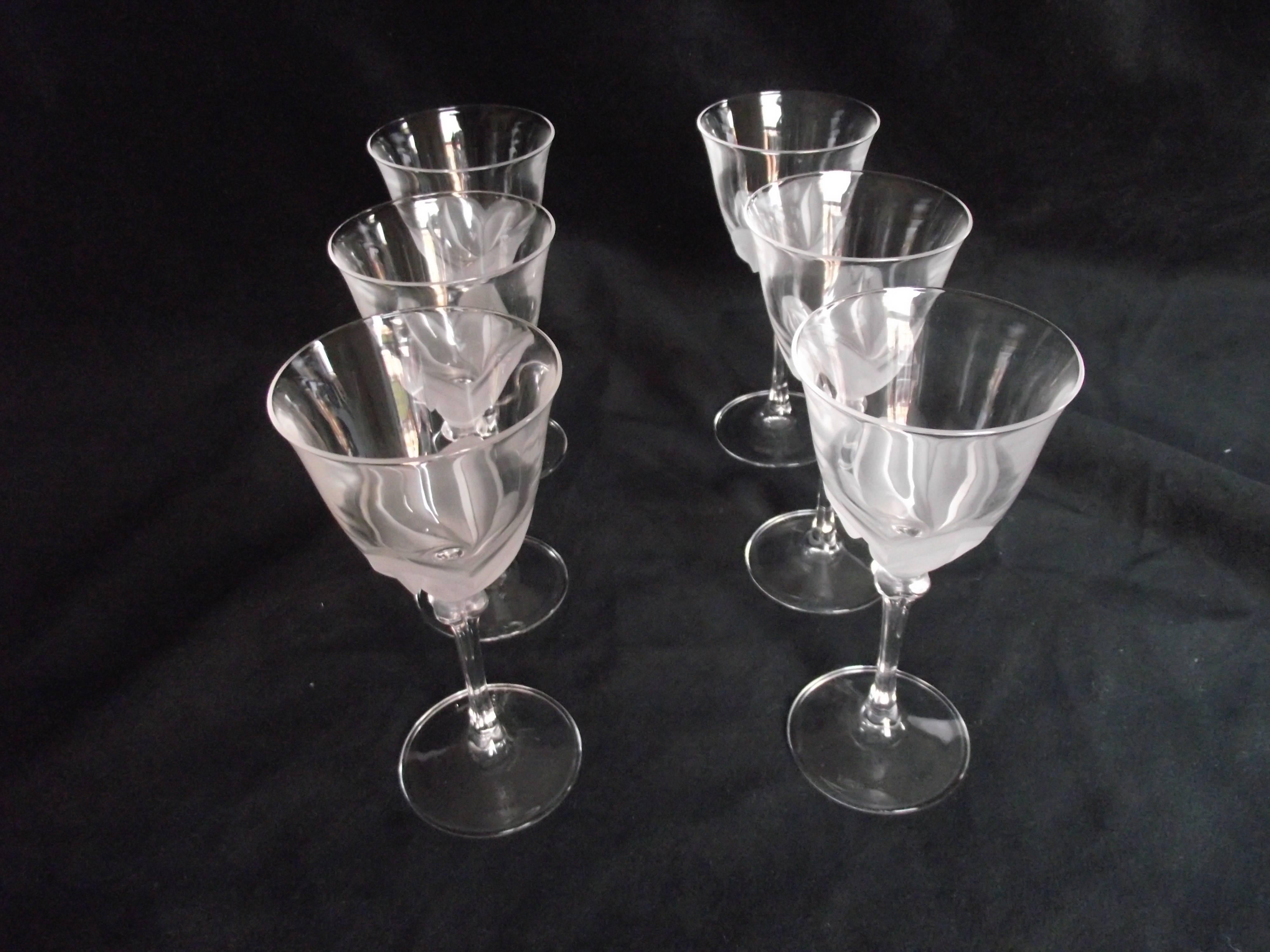 Very interesting clear and frosted glass patterned set of six wine glasses. They are by J. G. Durand and are in excellent condition. Signed on the bottom of each stem.
