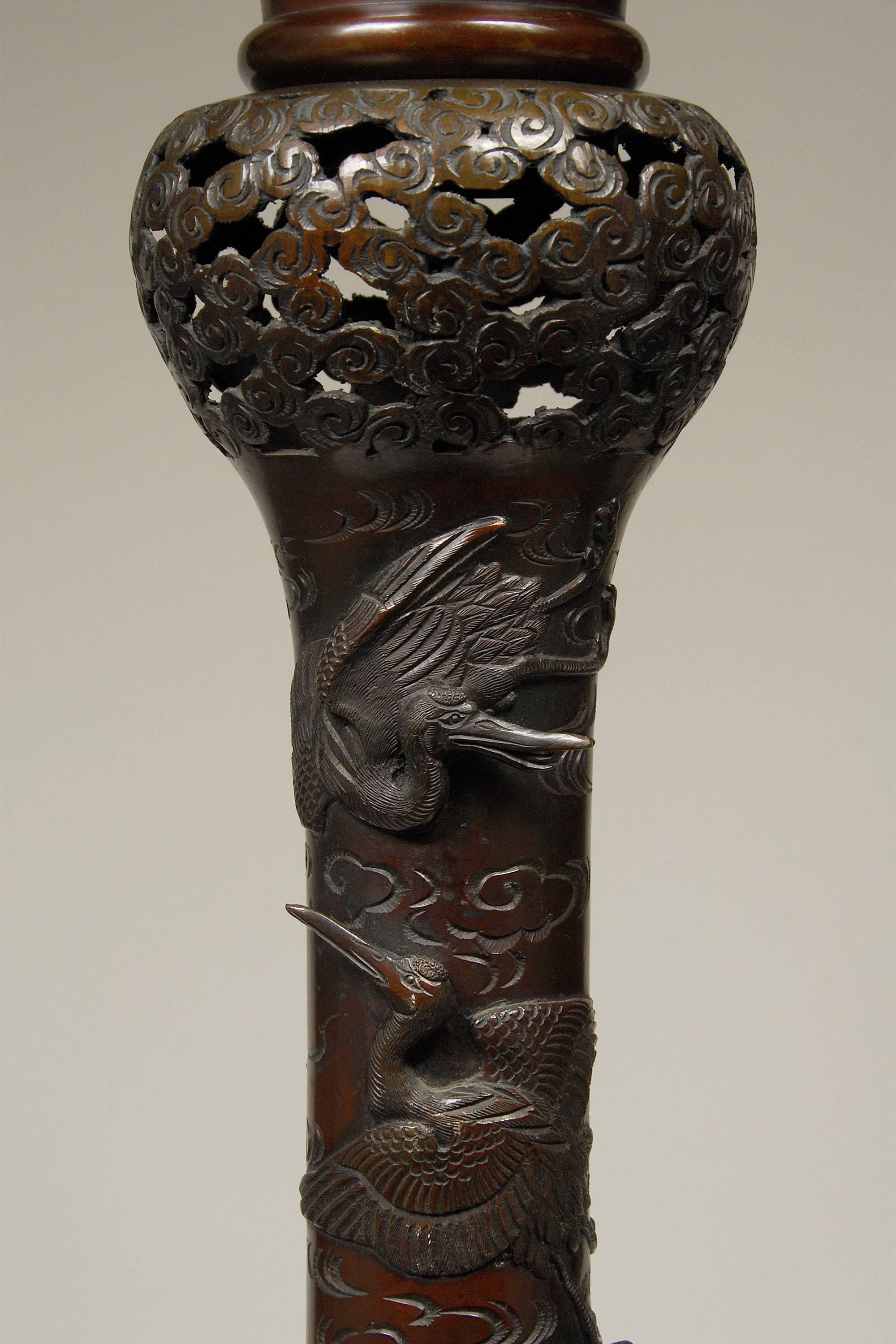 19th century antique Japanese Meiji bronze floor lamp.

This finely cast, well composed, pedestal lamp depicts mythical creatures on the base, cranes in high relief on the stem areas and birds among rocks and trees on the upper section. Each