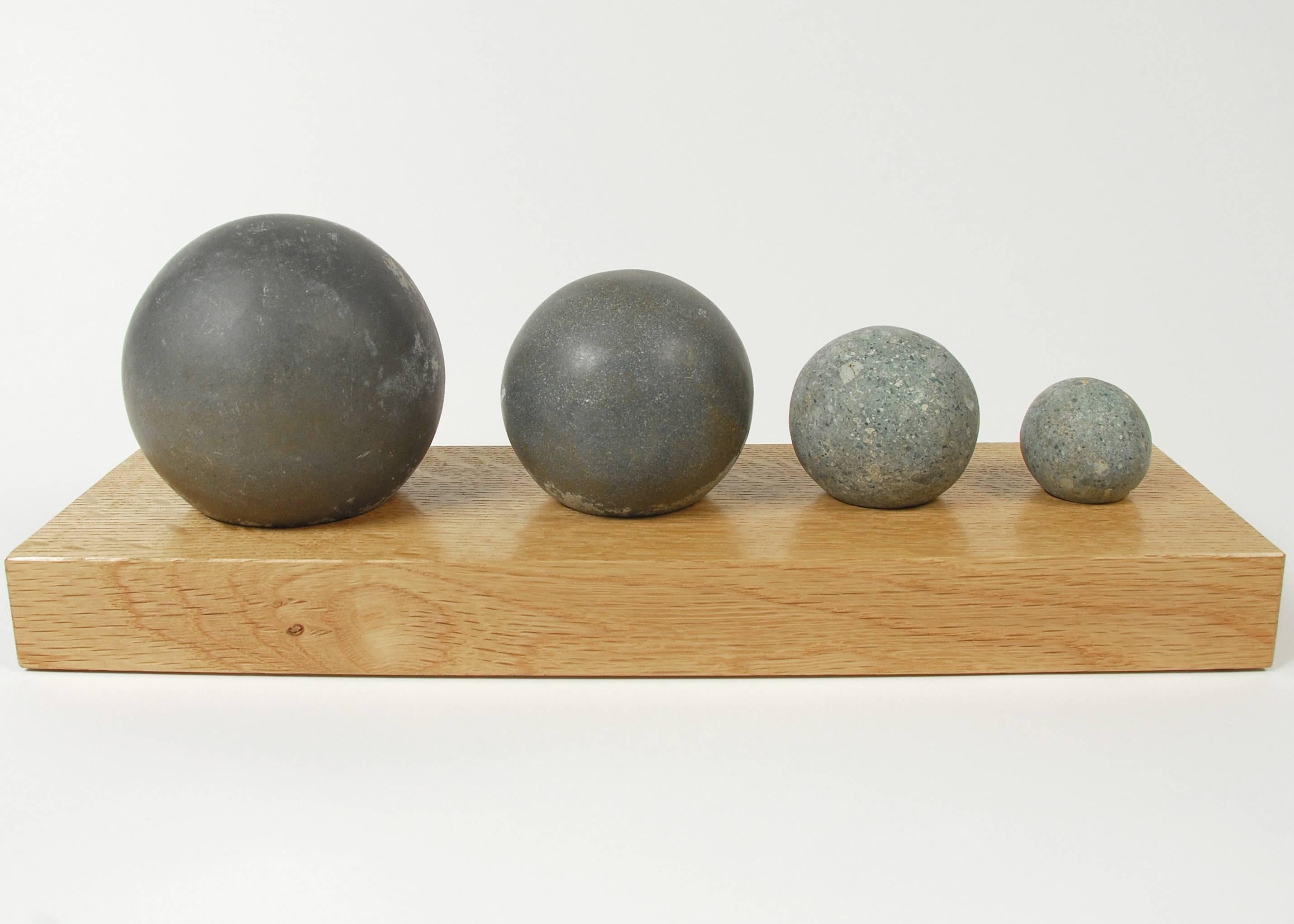 Prehistoric hand hewn stone balls, set of four.
Taino culture, Costa Rica and vicinity.

Each sphere would have been a symbol of the carver’s skill. They are made by pecking away material with another rock and then polished with various natural