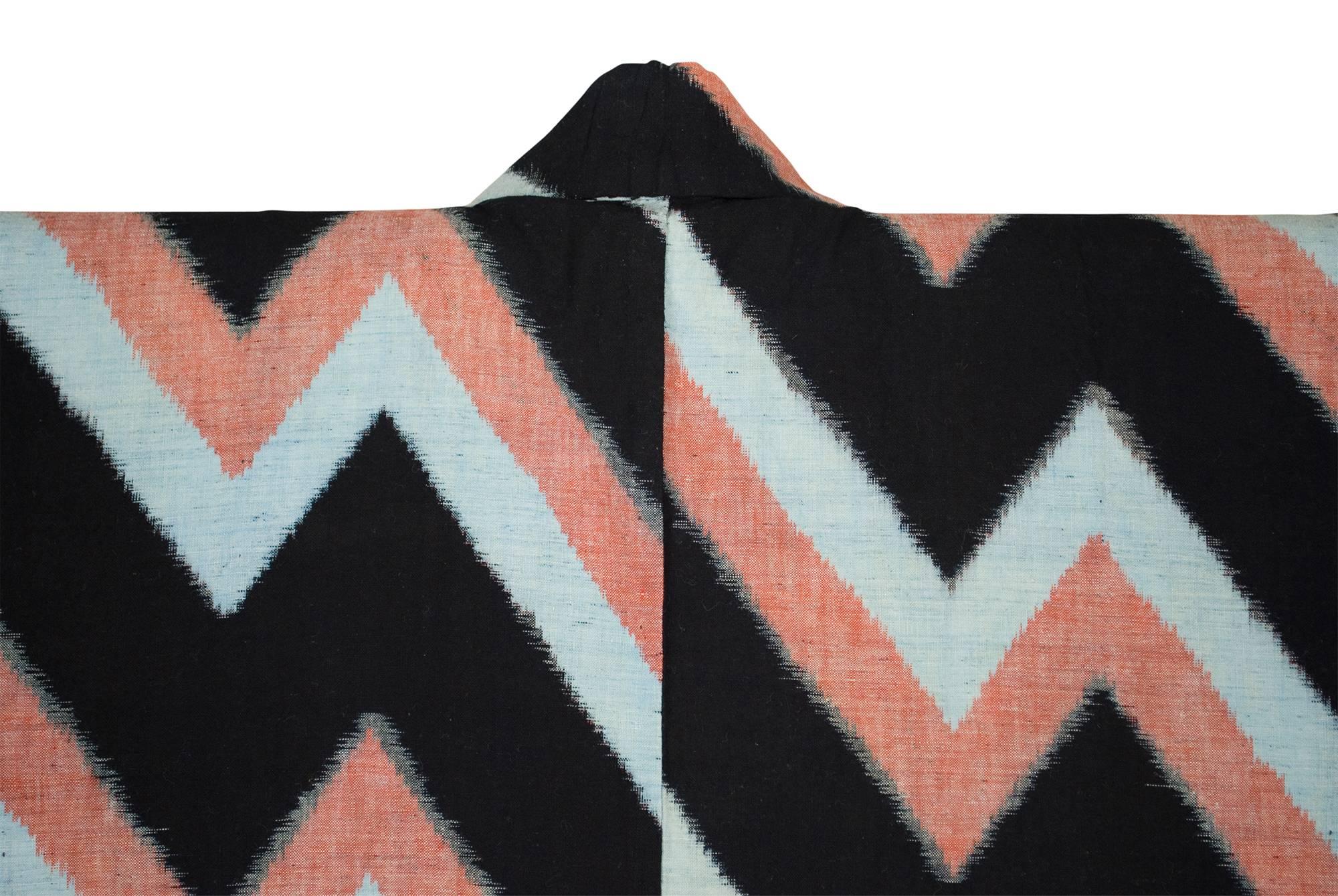 Cotton double ikat kimono, Japan, Early 20th Century

A graphically compelling example of a Bingo-gasuri kimono, produced in Hiroshima Prefecture, Japan.  Its lightening bolt design the result of both warp and weft ikat patterning. 