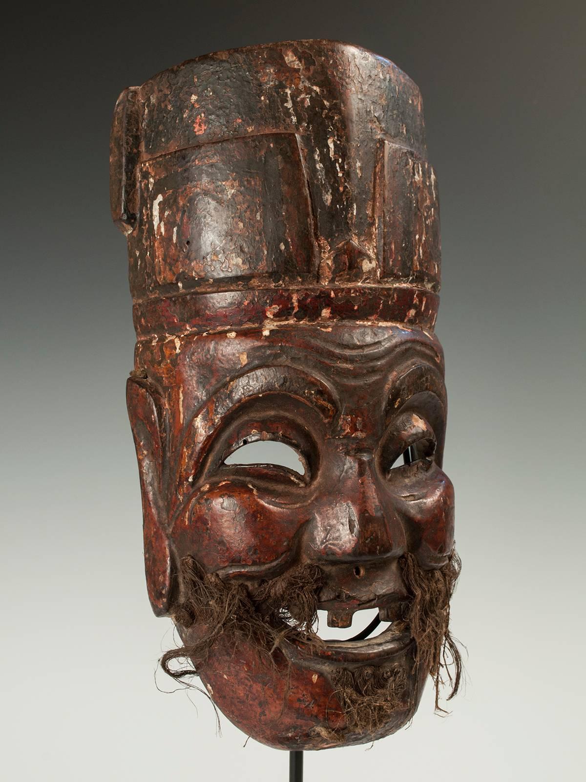 Late 19th-early 20th century Nuo Theater Mask depicting the god Tudi Gong, meaning 'Lord of the Place' in Chinese. The functions and deification of this god was local to each village, neighborhood and even home, so he was the ultimate bespoke deity.