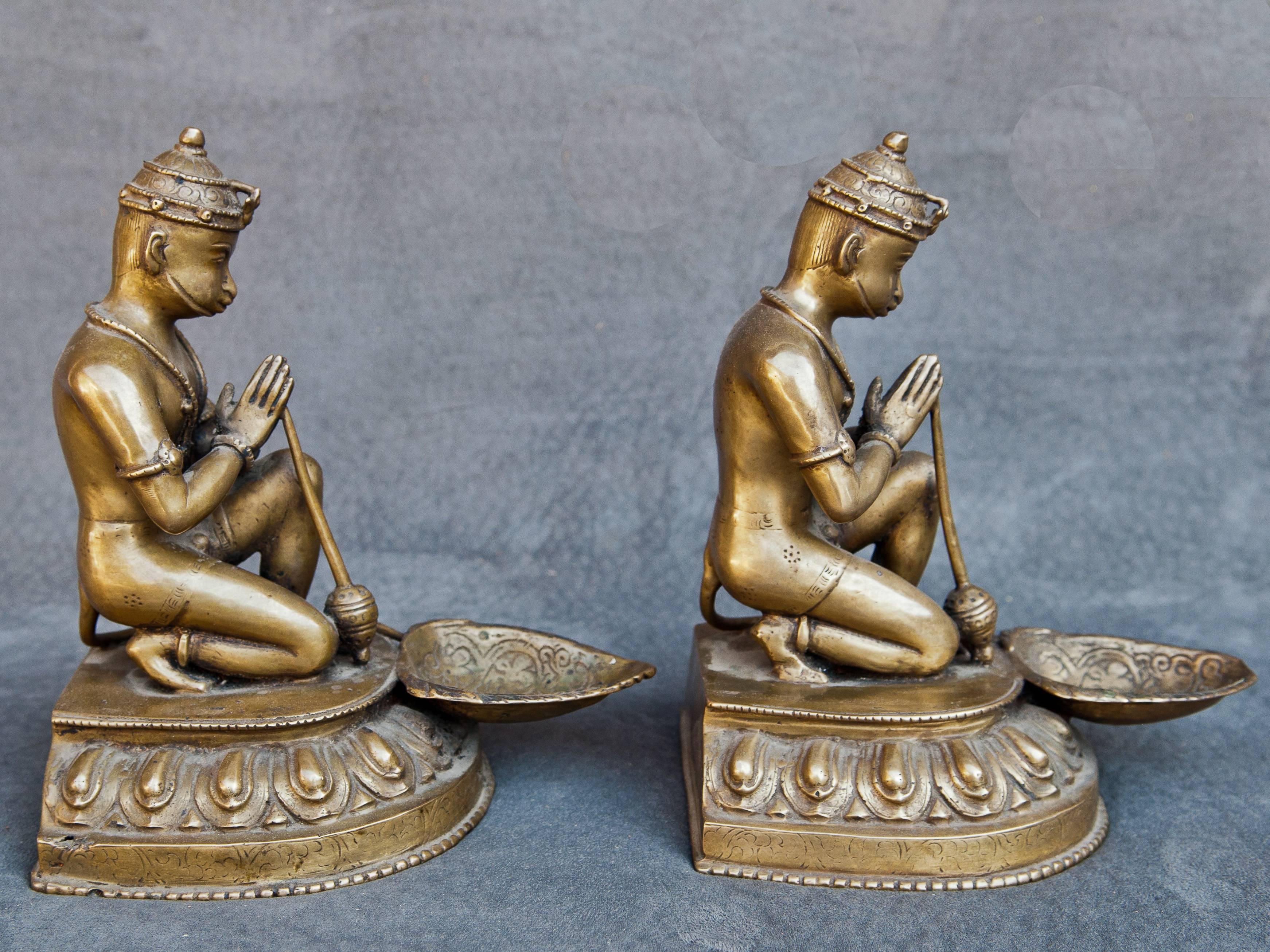 Pair of bronze Hanuman oil lamps, mid-20th century, Nepal.
Offered by Bo Tree Source.
Hand cast bronze oil lamps placed in a house shrine or temple. They portray the God Hanuman, devotee of Lord Rama and a beloved central character in the