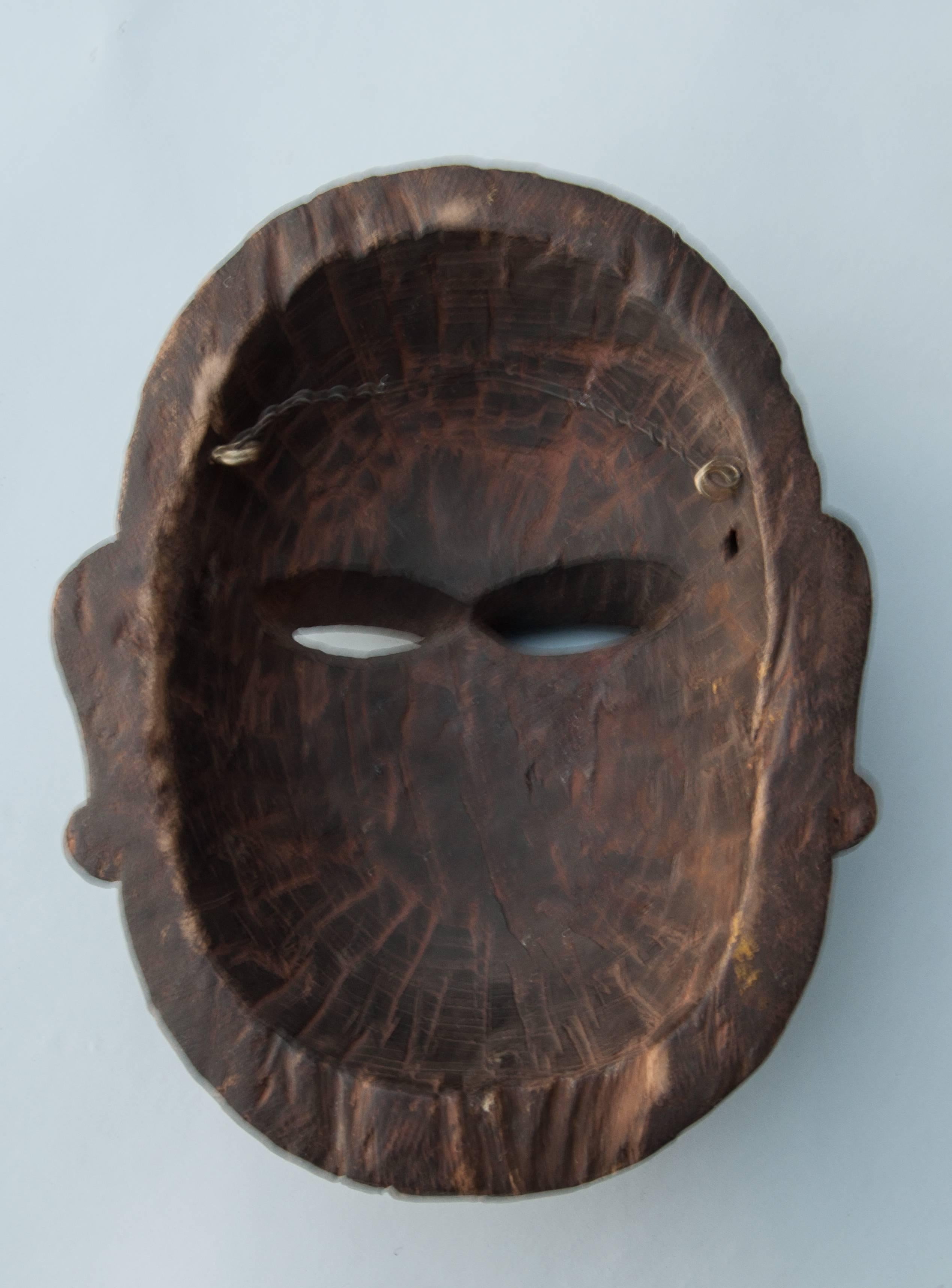 Hand-Carved Wooden Mask, Tharu of Nepal, Early 20th Century