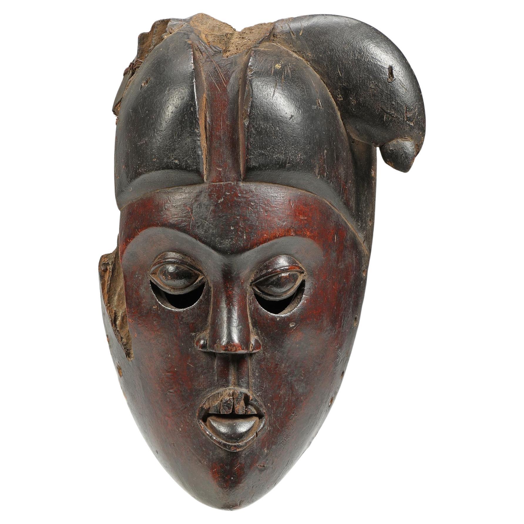Fragment de masque Ibibio, visage rouge foncé, yeux expressifs, Afrique du début du 20e siècle