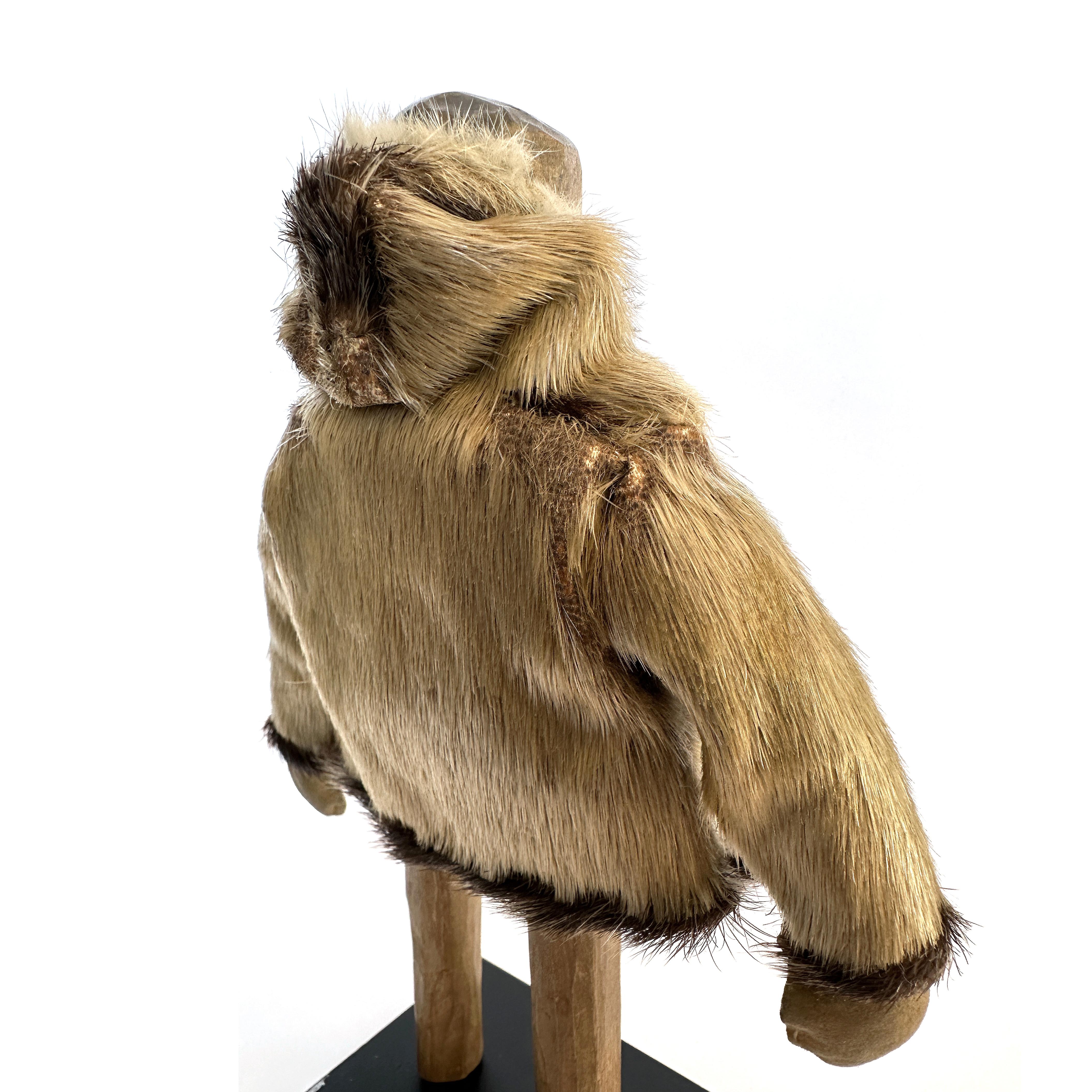 American Eskimo Wood Carving of a Man with Seal Coat, North Coast, 20th Century For Sale