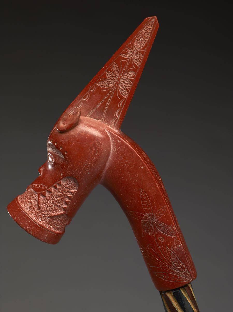 Offered by Vicki Shiba.
Carved red catlinite pipe bowl and wooden stem,
Northern Plains, Sioux.

A fine object with expressive, lyrical qualities. The red catlinite pipe bowl is carved by a well-known hand, known as the 