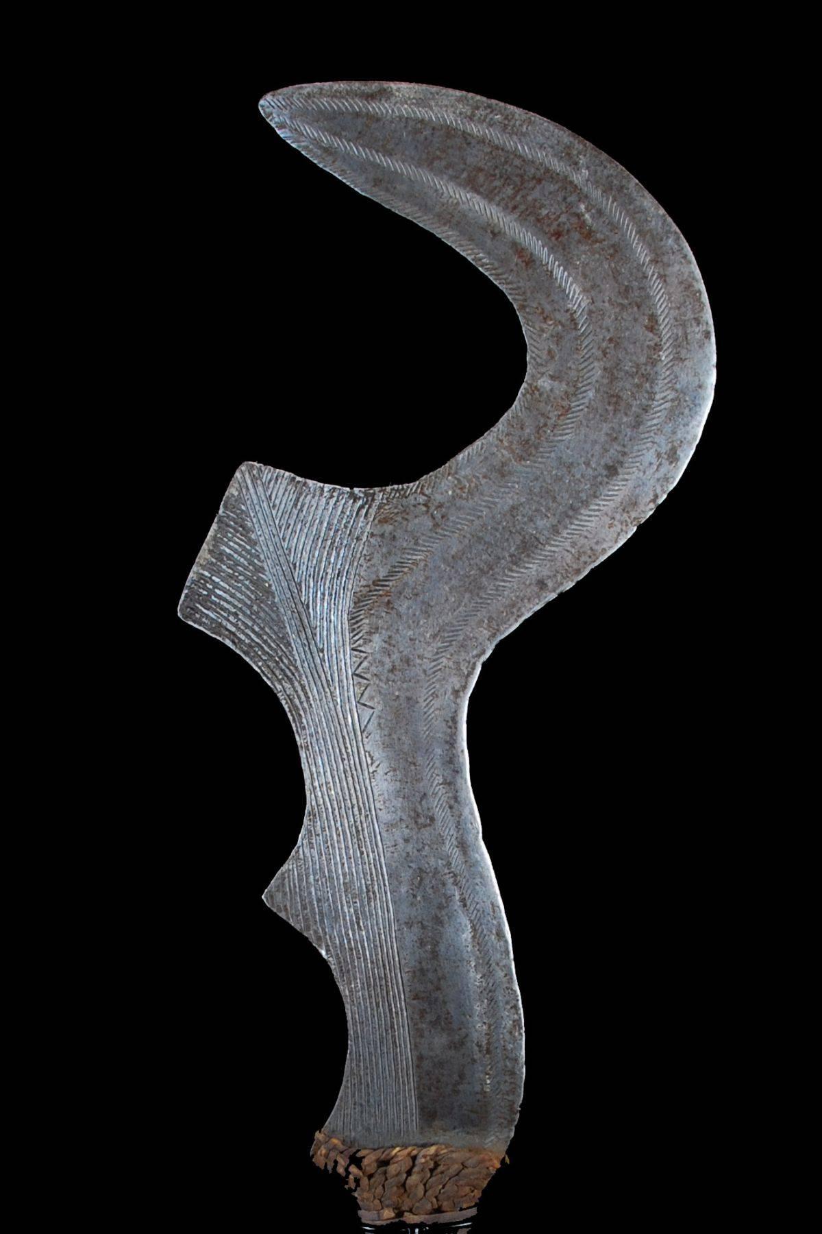 Offered by CALLIE MORGAN OAKES
African Ngulg Ceremonial Status Sword Democratic Republic of Congo, circa 1920s 
Ngombe Culture, Iron, Copper Strips, Wood, Leather

This status symbol is carried by a man as an emblem of rank.  The sword is an