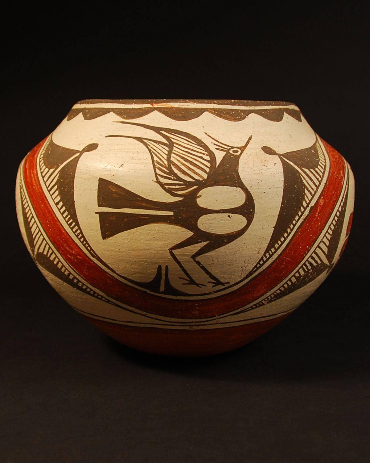 Offered by Callie Morgan Oakes 
Circa 1950s Native American Indian tribal pot
Seferina Bell, Zia Pueblo, New Mexico

This is a classic Seferina Zia jar with her distinct double tailed Zia bird which Harlow and Lanmon in The Pottery of Zia
