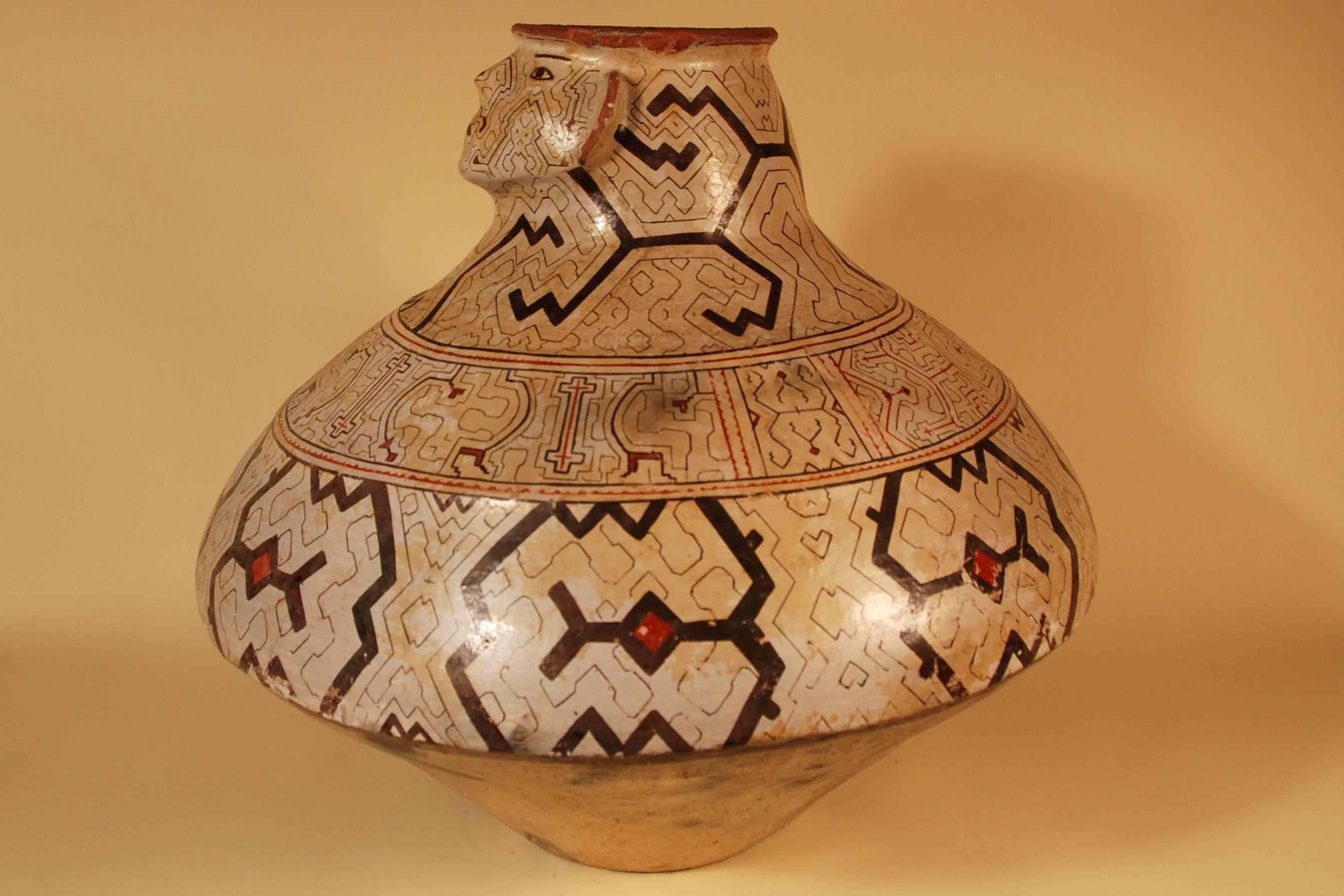 Offered by Callie Morgan Oakes
Mid-20th century large tribal ceramic single faced one of a kind pot
Shipibo culture Peruvian Amazon.

Each design is unique. With its natural pigments and bold geometric design the effect is a striking, handsome