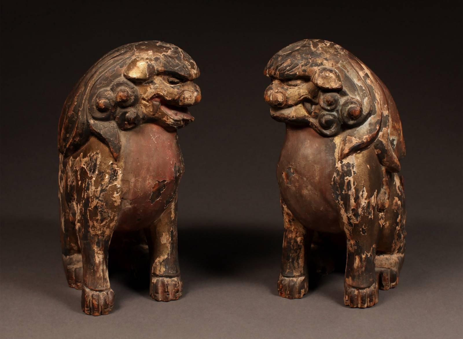 Offered by Vicki Shiba.
18th century pair of polychrome wood Shinto lion-dogs, Komainu, from Japan.

Expressively carved of cypress wood with curlicue manes and tails, the natural grain of the wood used to indicate the coils of fur, the mouths