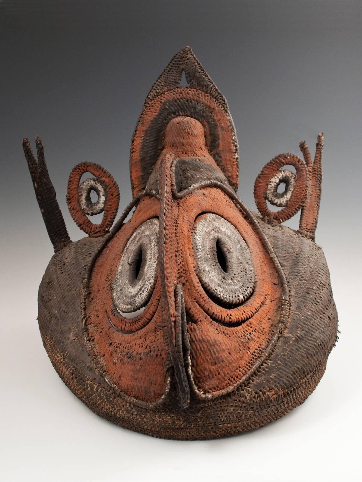 Offered by Zena Kruzick.
Early to Mid-20th century tribal Abelam Bapa helmet mask, Papua New Guinea.

Coiled cane, natural pigments.
Measures: 15" (38 cm) high by 13" (33 cm) wide.
These "bapa" masks represented frightening