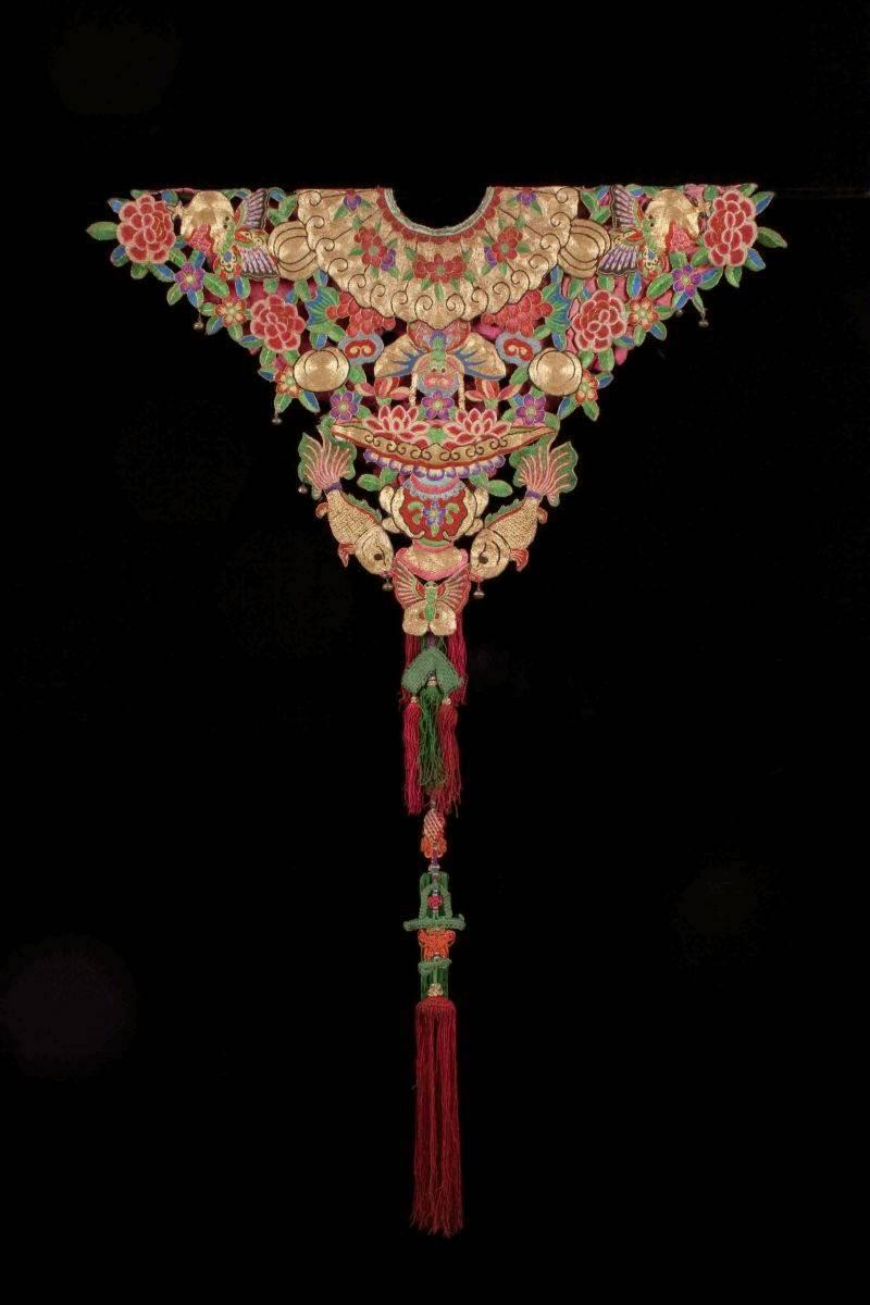 Offered by Vicki Shiba.
Early 20th century Lady's festival collar, China.

A lovely example of a lady’s festival collar, this piece is embellished with Peking glass jewels and Peking forbidden stitch embroidery to create the auspicious flower and