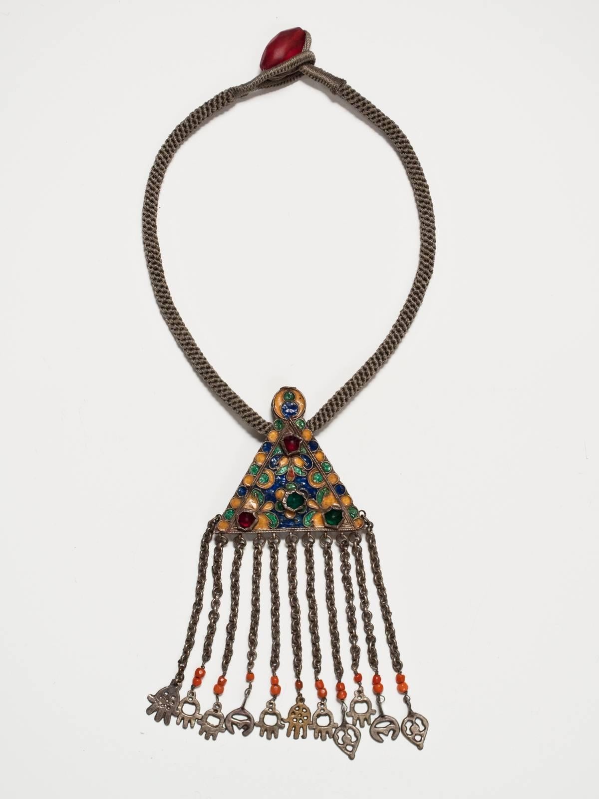 Early 20th century enamel and silver necklace, Djerba Island, Tunisia.

This is a very rare type of enamel and silver pendant from Djerba Island, Tunisia; I've only seen one other example in my many trips to this country. It is called a 'cotbat'