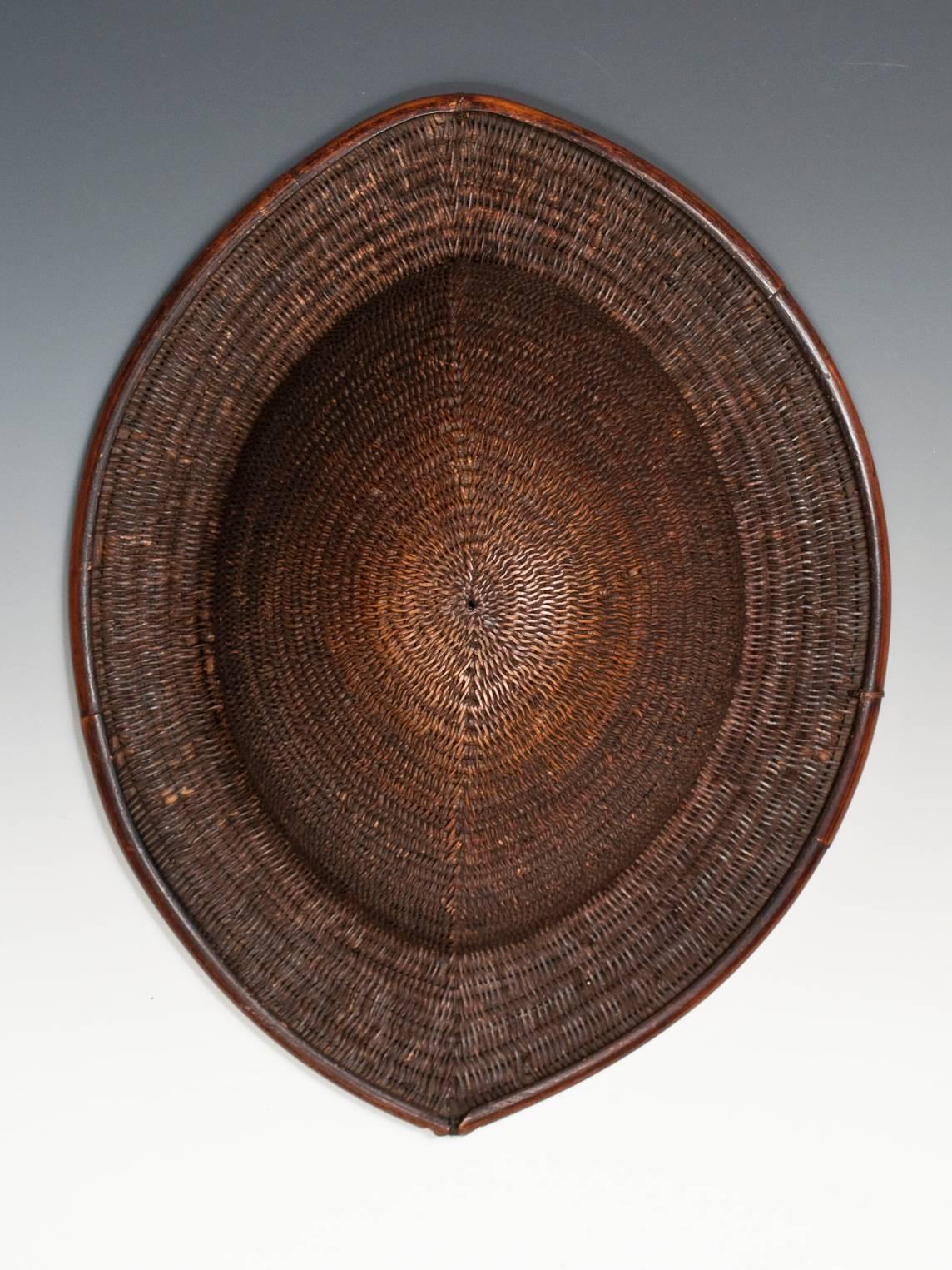 Offered by Zena Kruzick

Late 19th century rattan and bamboo helmet, Northeastern India.

This tightly woven helmet is likely from a tribe in Northeastern India. Two small holes at the interior edge of the rim suggest it was at one time secured to