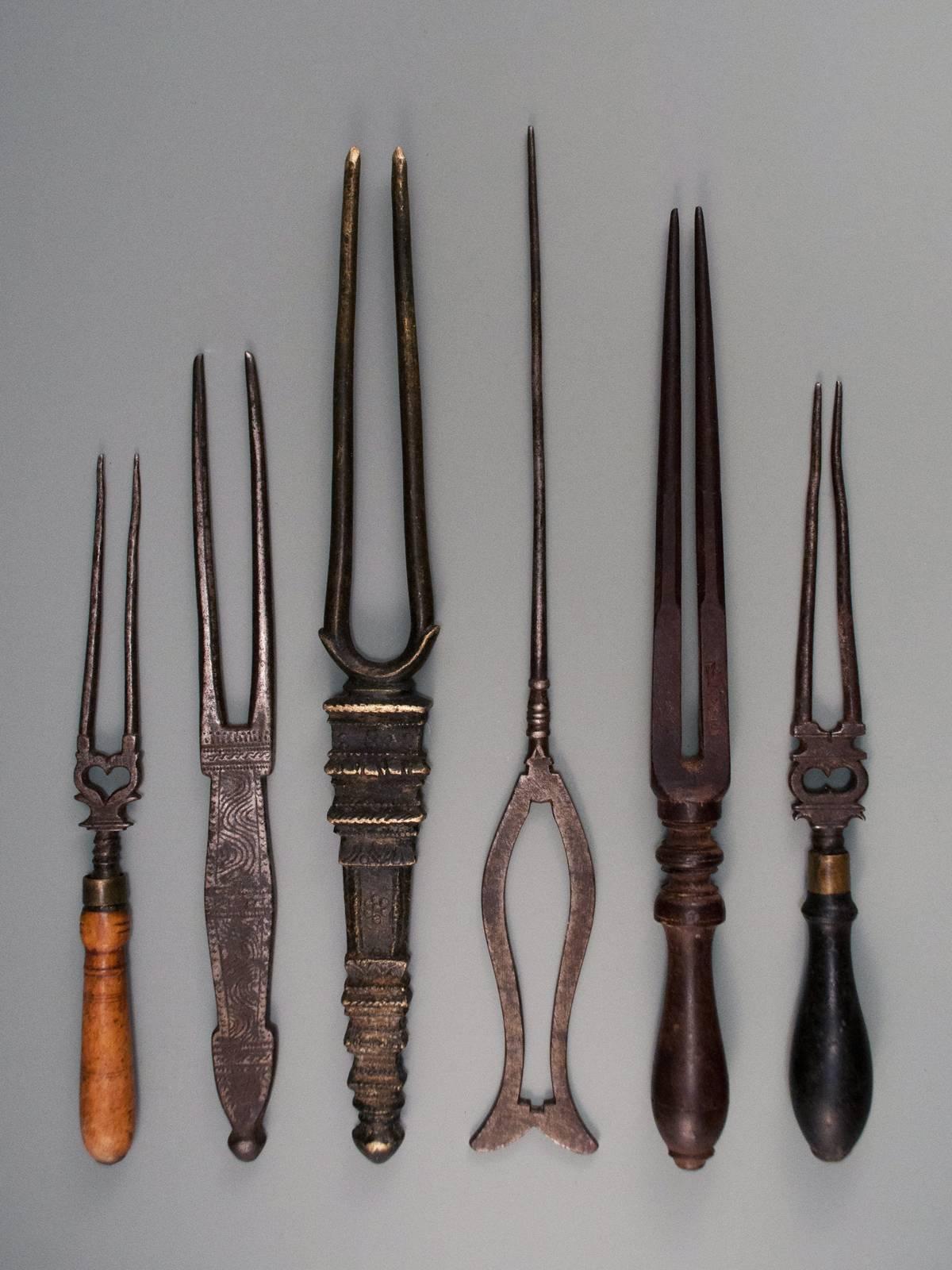 Six early 20th century hair detanglers from Kerala and South Karnataka, India.

An unusual group of six hair detanglers found exclusively in Southern India. The carved wooden example seen second from the right has some script characters incised on