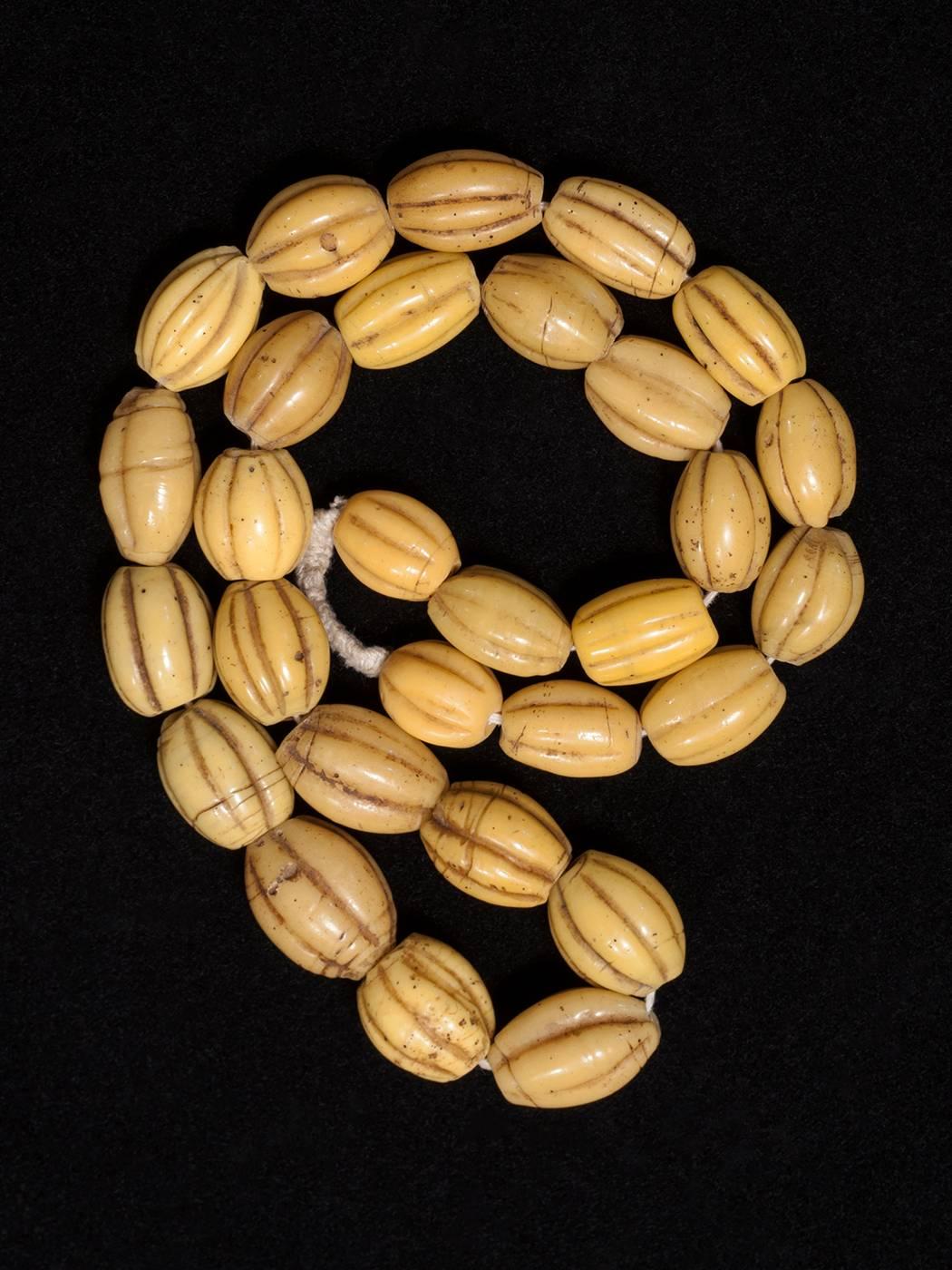 Offered by Zena kruzick
Late 19th century yellow glass melon beads from China

These beads are found in Irian Jaya and used as bride price. From Robert Liu's book Collectable Beads, p 92, "Glass beads from Irian Jaya are most likely Chinese,