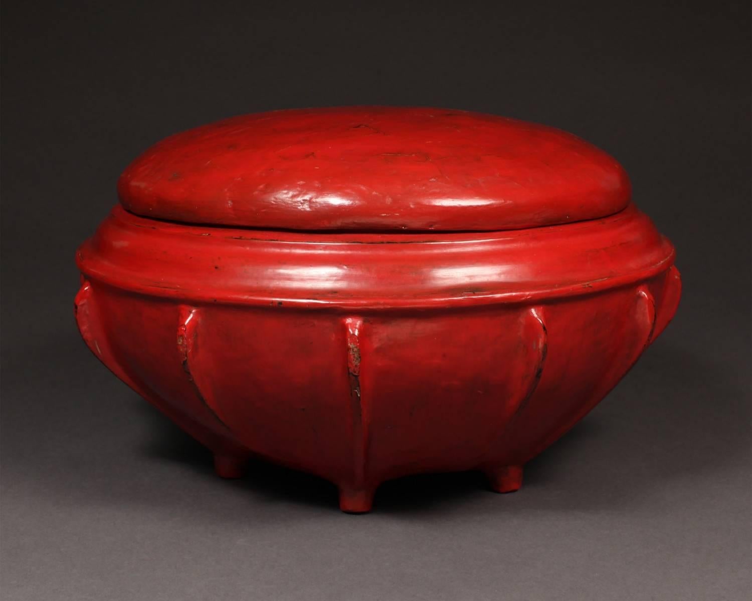 Offered by Vicki Shiba
Late 19th-early 20th century lacquered offering vessel, Hsun-ok, Burma

A red lacquered 12-ribbed container with cover designed to carry meals for monks and high officials.
 