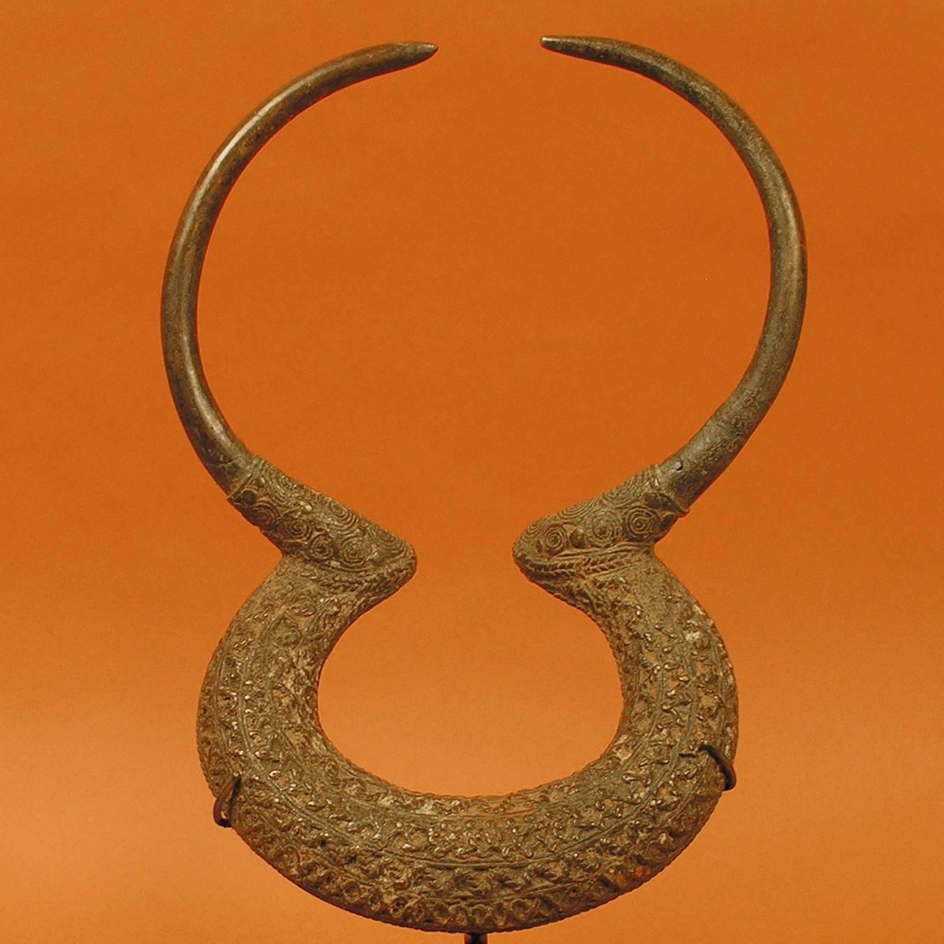 20th century armband currency, Kenga culture, Chad, Africa

The artistry of this man's armband creates an elegant zoomorphic form reminiscent of buffalo horns. The level of detail in the casting reflects the importance it held as a currency. A man