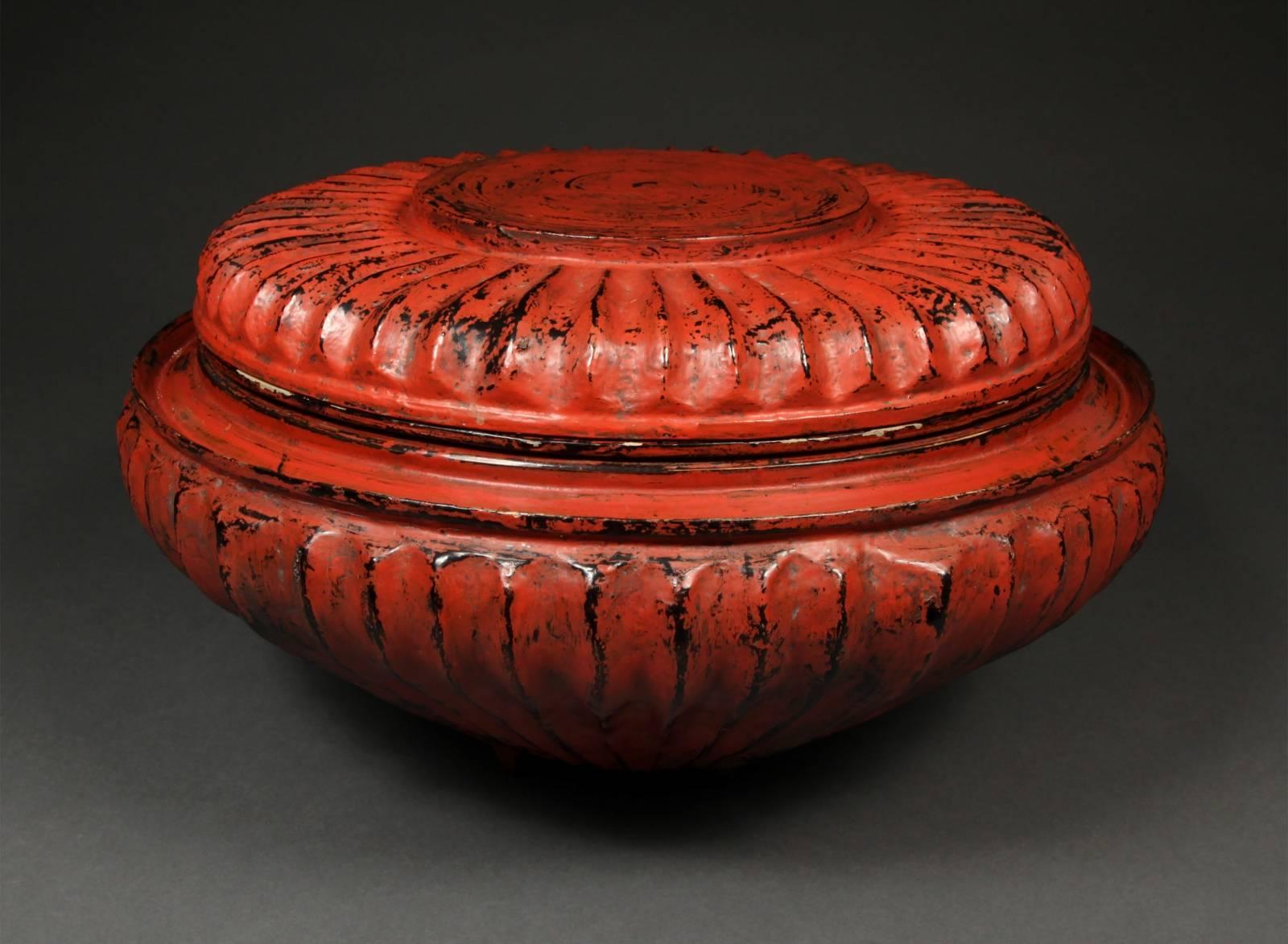 Offered by Vicki Shiba
Late 19th-early 20th century lacquer offering vessel, Hsun-ok Burma

An unusual ribbed Hsun-ok, food offering box. Such containers were designed to carry meals for monks, high officials and wealthy individuals.
  