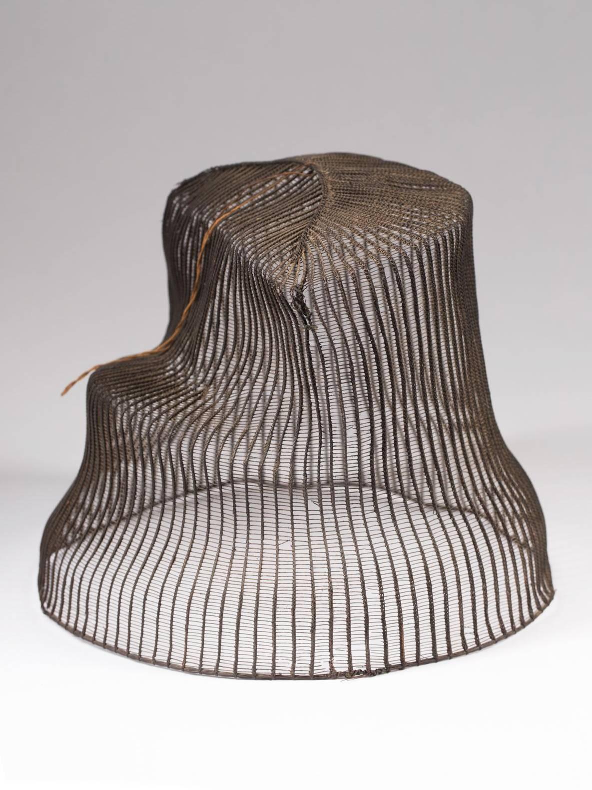 Late 19th century horse hair hat with original wood base, Korea

The tanggeon hat was worn by nobility, as well as men in the commercial and medical fields. It would cover the mangeon, which was a horse hair head band that would keep the hair in