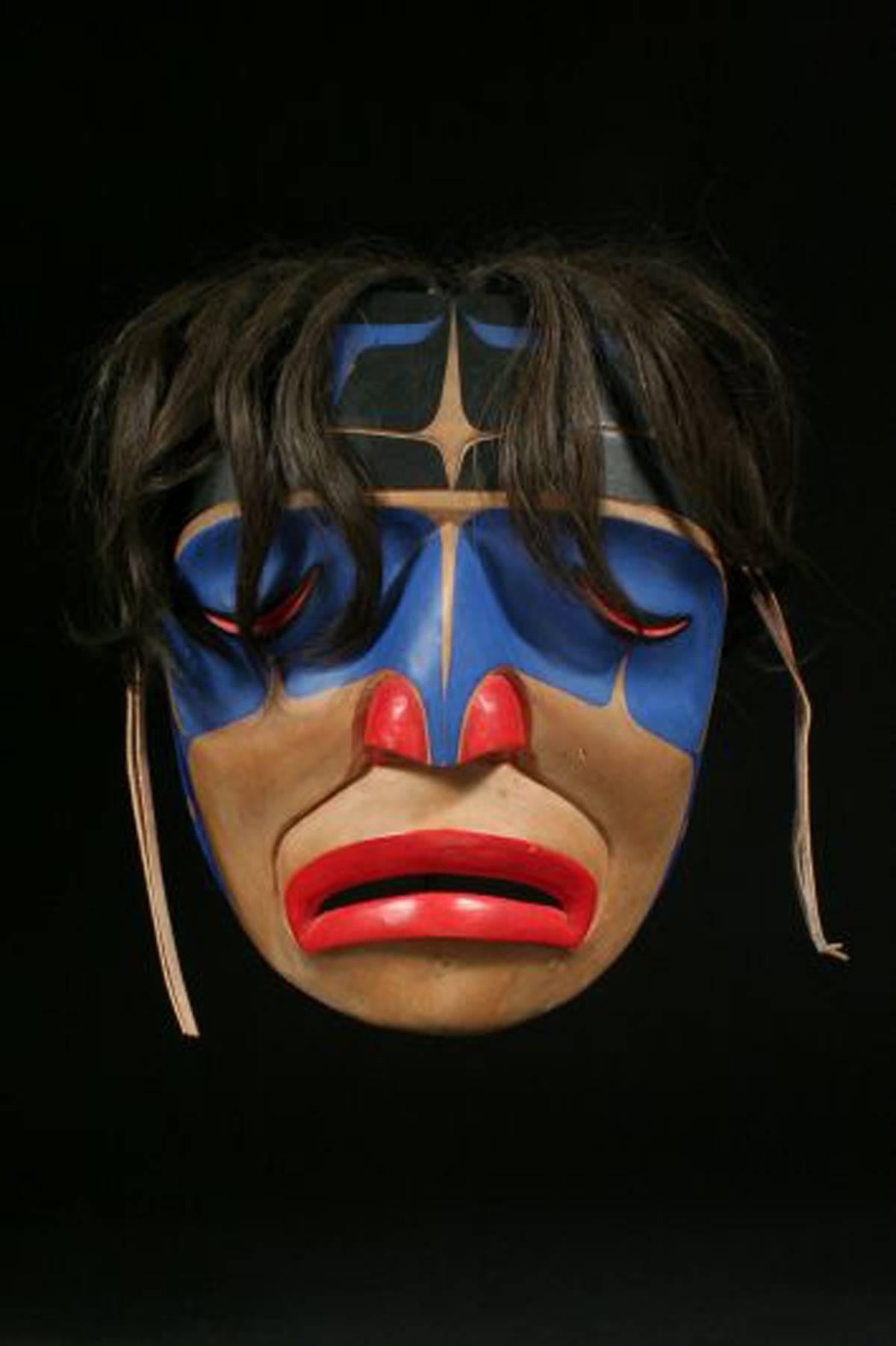 20th century North West Coast American Indian signed Tribal Crying Mask George Hunt Jr.
Kwakiutl, British Columbia
Cedar, horse hair, leather, paint

A striking, graphic mask with the distinct North West Coast styling of clean lines and bold use of