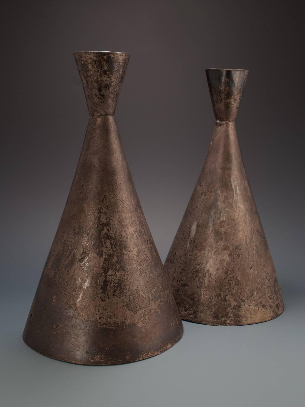 9th century silver processional priest's hats, Chimu culture, Peru.

These silver hats were originally covered with fabric, as can be seen in the remaining surface pattern. The holes in each side were used for ties.
 