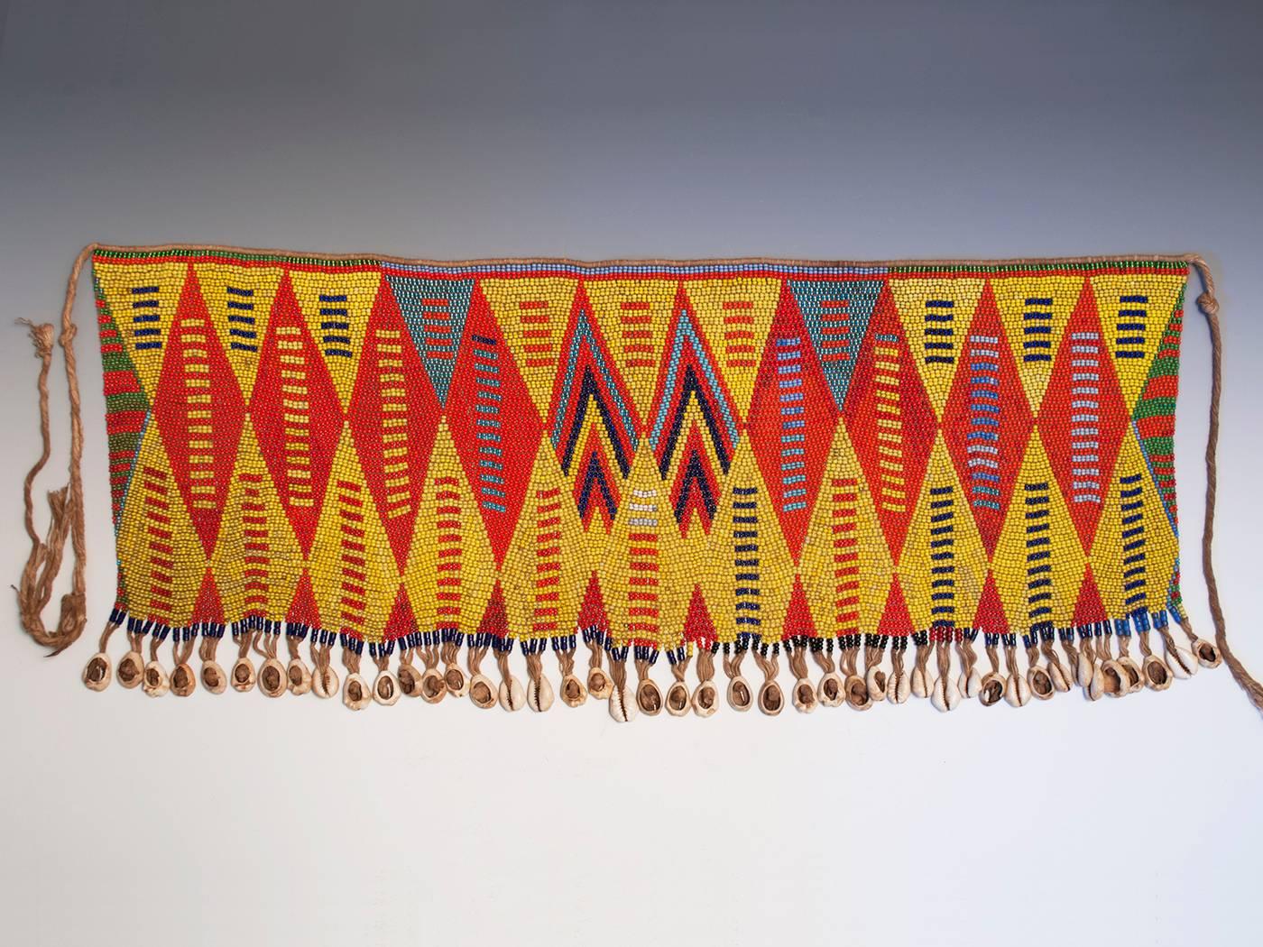 Offered by Zena Kruzick
Mid-20th century tribal beaded cache-sexe modesty apron, Bana Guili people, Mandara Mountains, Cameroon, Africa.

These colorful cache-sex (pikuran) were worn for celebrations, rituals and rites of passage by women who had